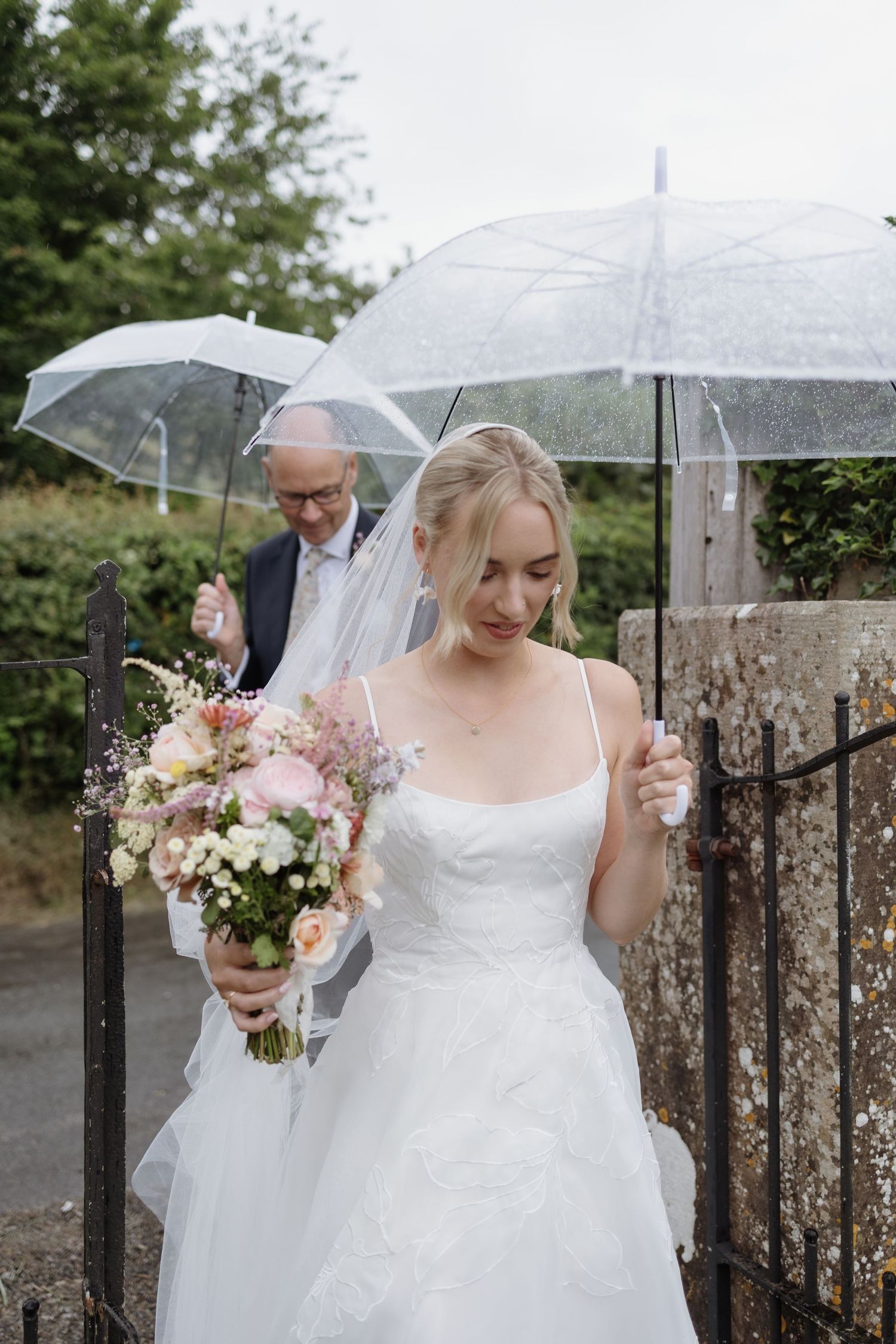 candid elegance on a rainy wedding day