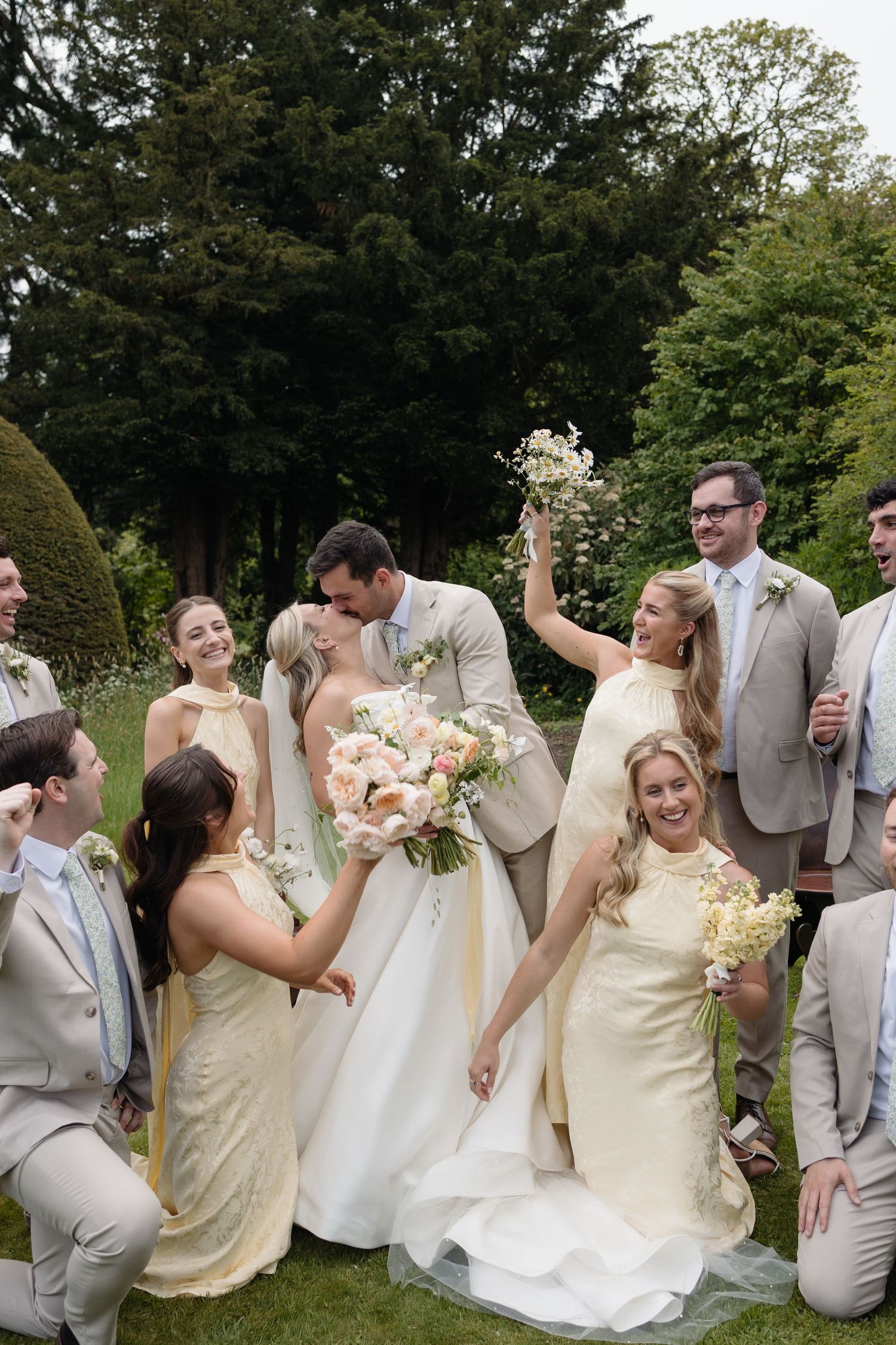 Bridal party at Askham Hall in butter yellow
