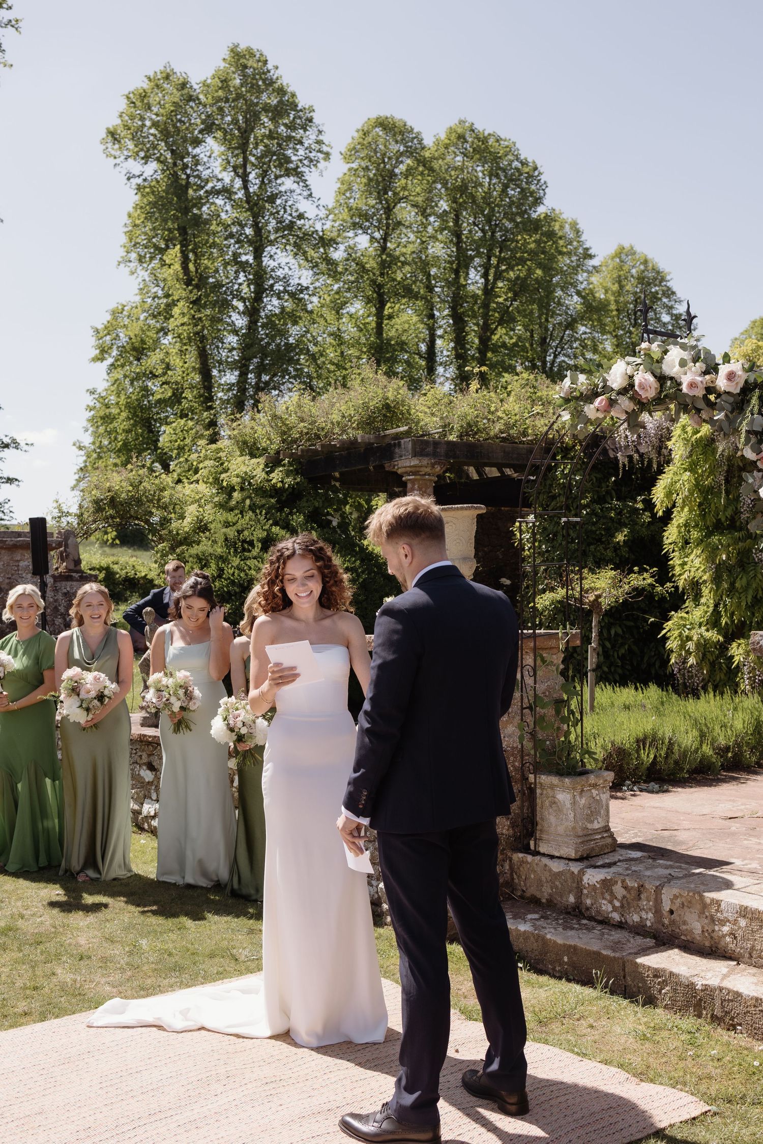 Romantic outdoor ceremony surrounded by greenery at Holesfoot