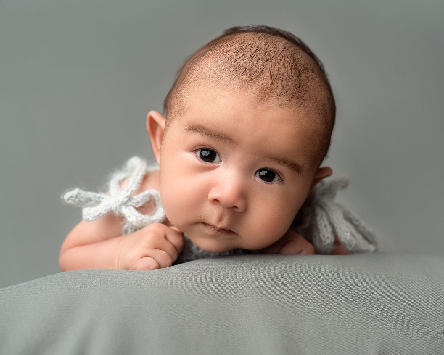 Newborn photography in Gravesend Kent with baby close up portrait on soft neutral background