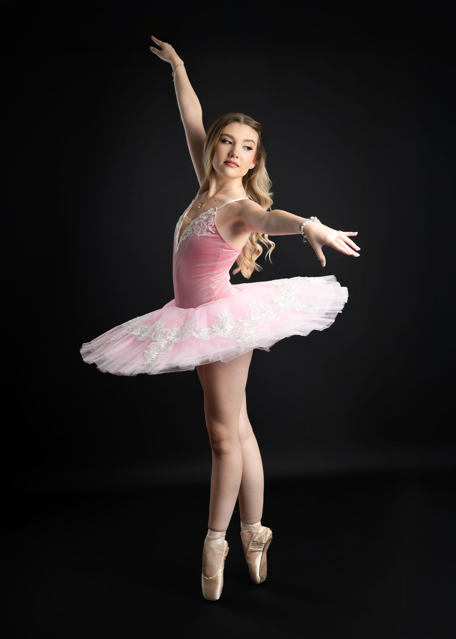 Dance photography session in Gravesend Kent with ballerina in pink dress performing in studio