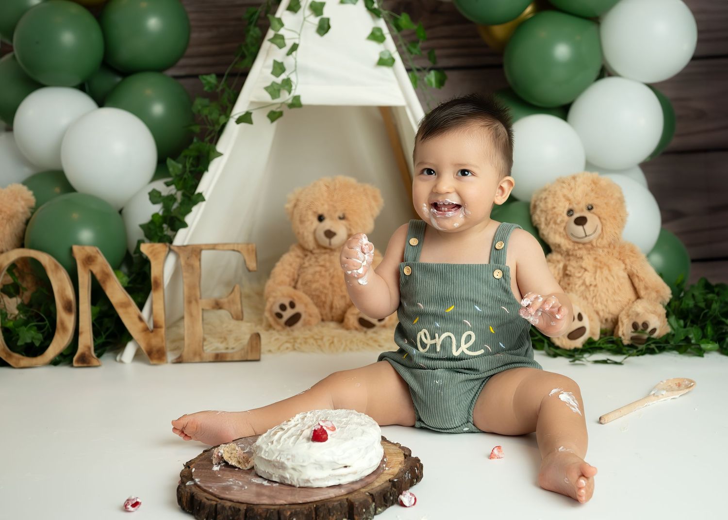 Cake smash photography session in Gravesend Kent with baby celebrating first birthday with balloons and cake