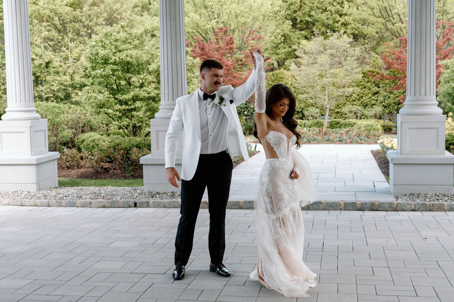 Groom spinning his bride
