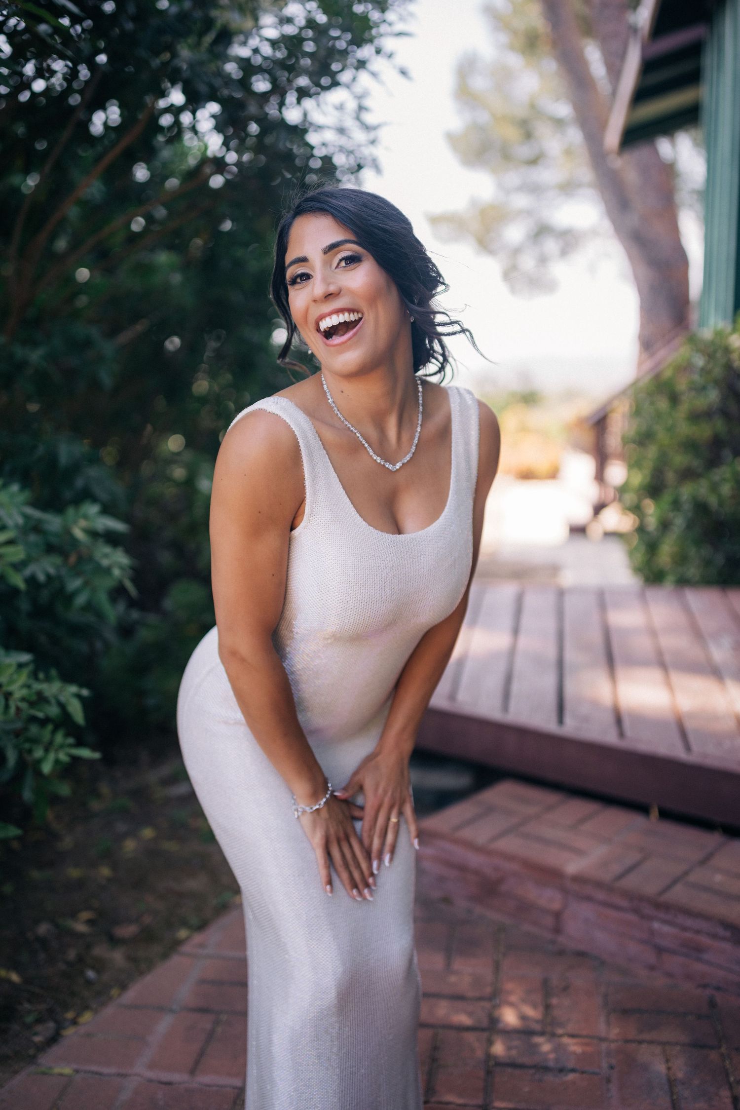 Beautiful wedding portrait on a rustic wooden deck in natural lighting.