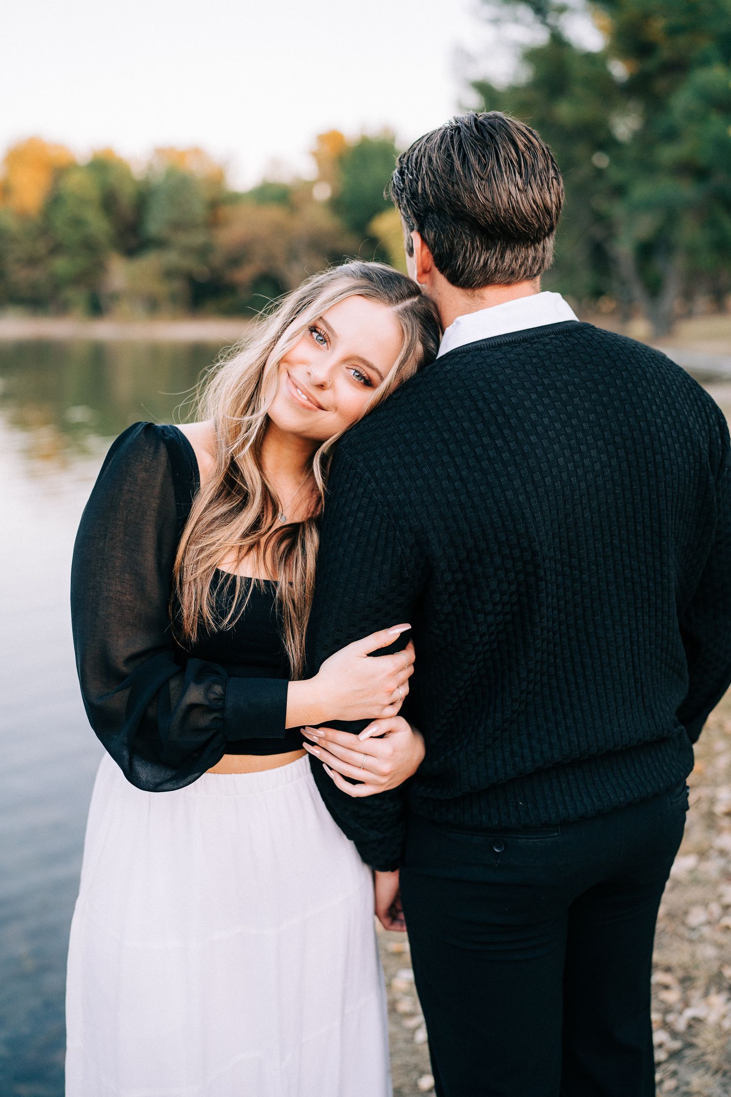 Series of candid romantic moments between couple wearing black and white during fall photo session.
