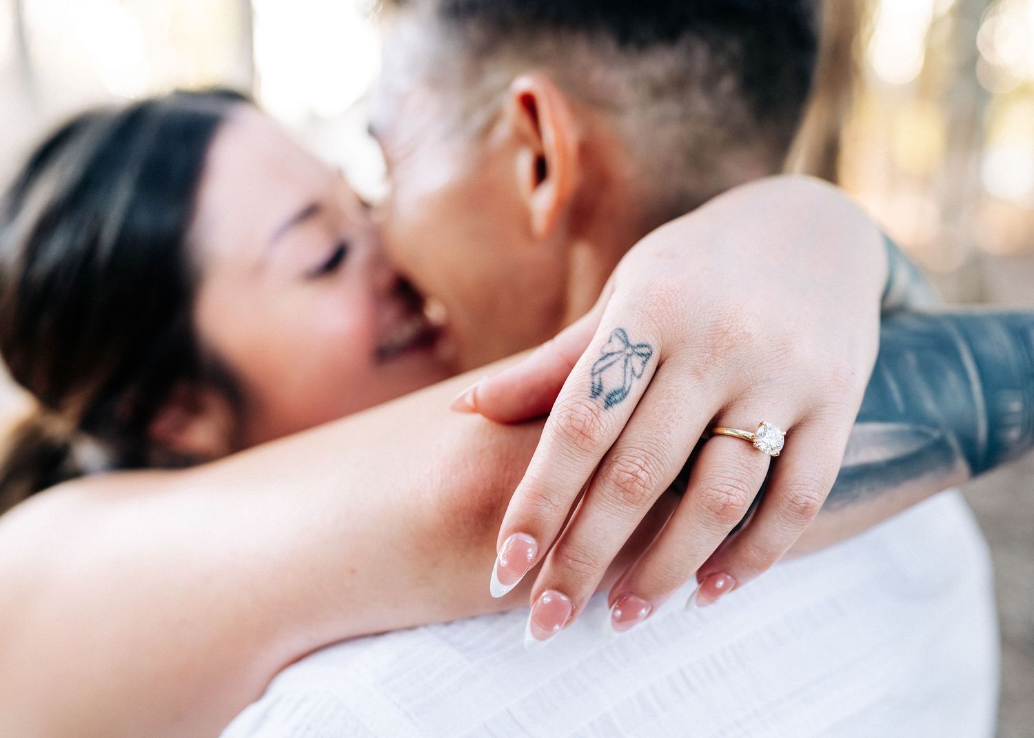 A series of romantic couples sharing intimate kisses in a softly lit setting.