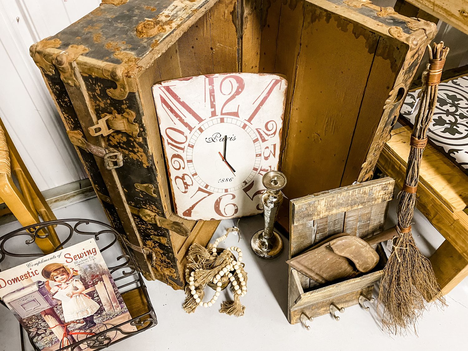 Vintage wooden box with antique clock face and decorative elements.