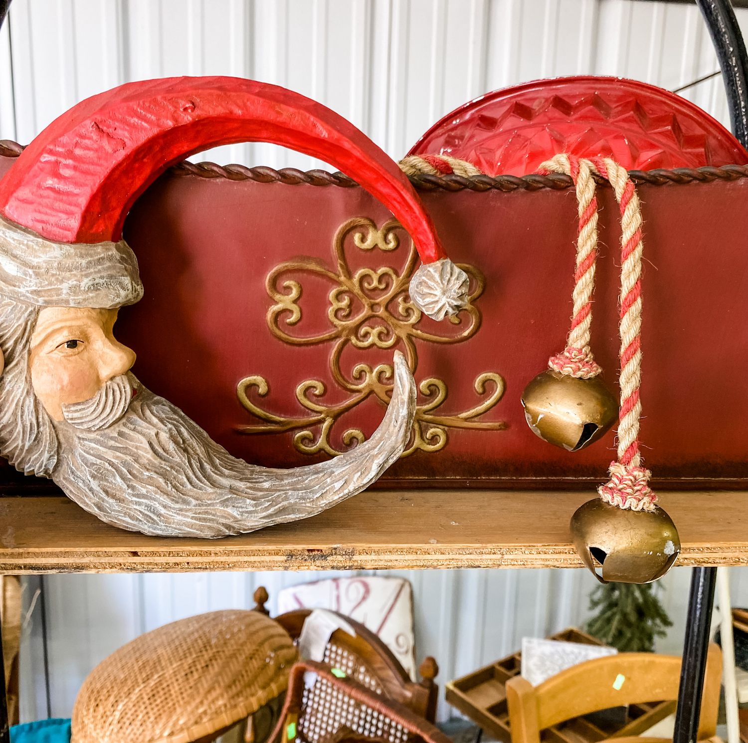 Red decorative Christmas ornaments with festive designs and rope accents.