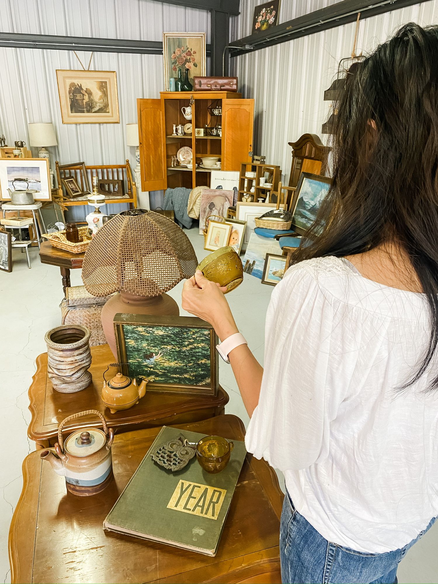 Vintage antique shop interior with furniture and collectibles on display.