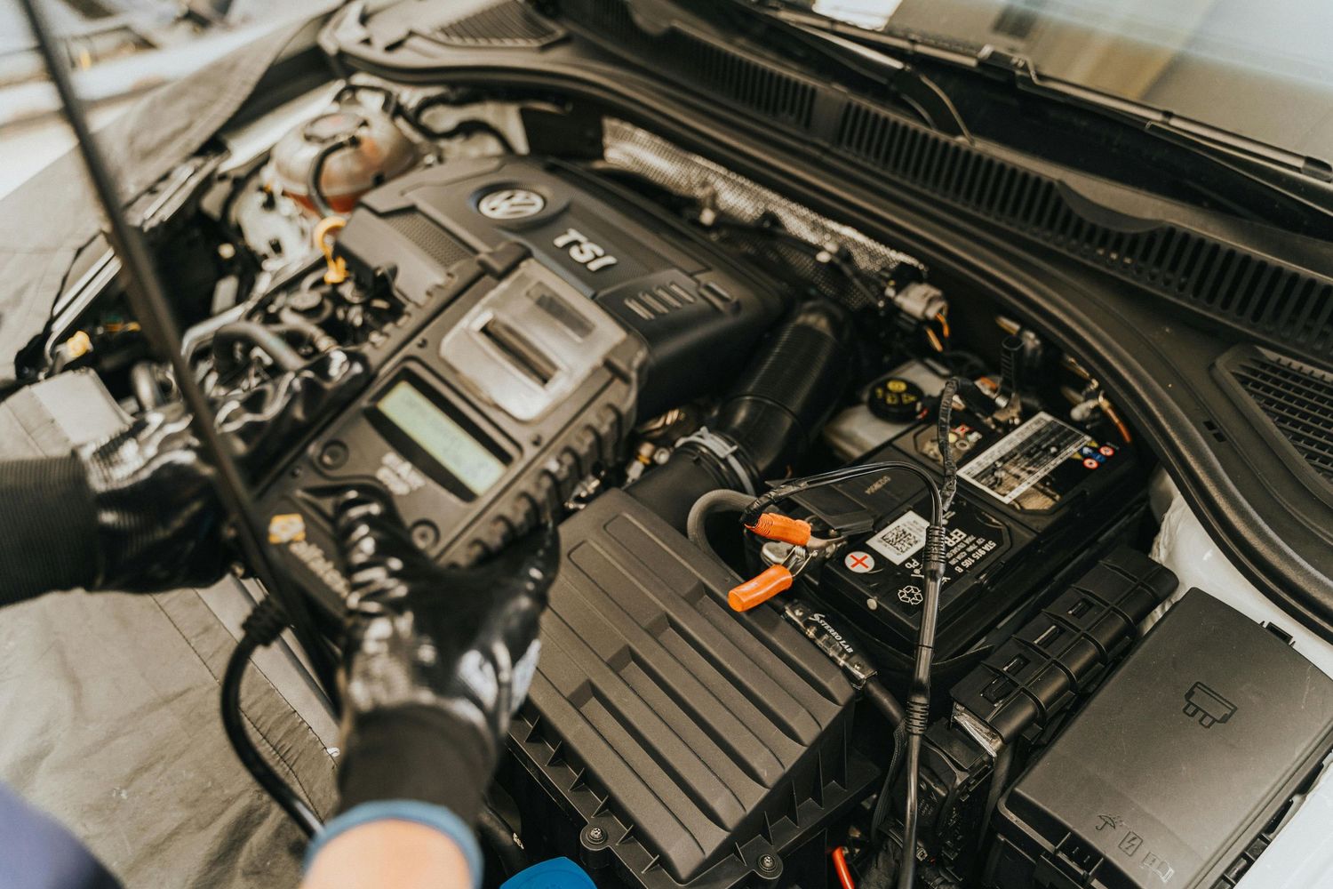 Checking vehicle battery and terminals during inspection
