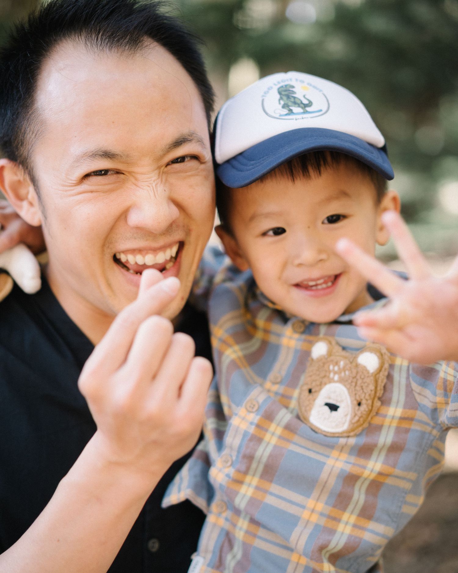 A series of candid expressions showing joyful laughter and genuine smiles in a natural outdoor setting.