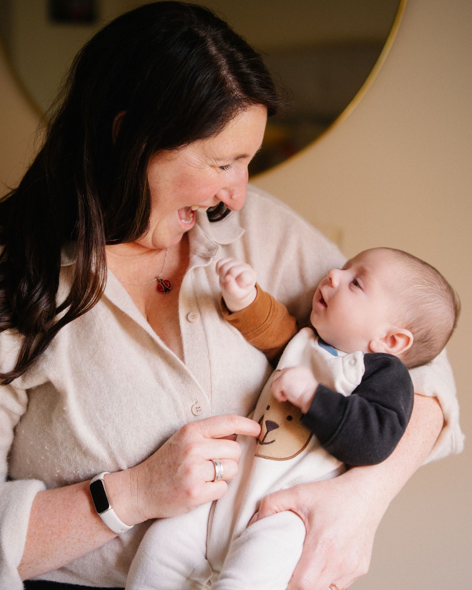 A series of tender moments between a parent and baby shown in sequence as they interact and play together.