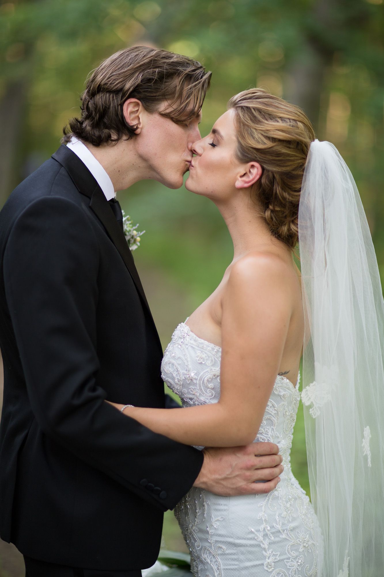 Romantic wedding photography sequence showing tender moments between newlyweds in an outdoor garden setting.