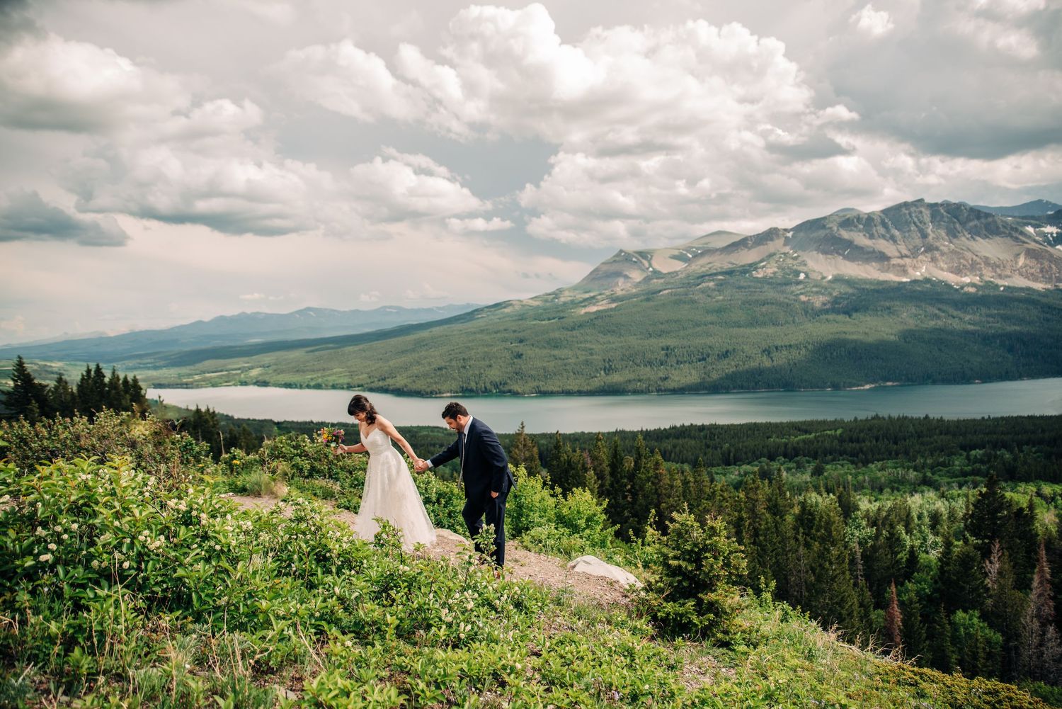 A series of mountain landscape photos with dramatic cloudy skies and rolling green hills shows a scenic elopement setting.