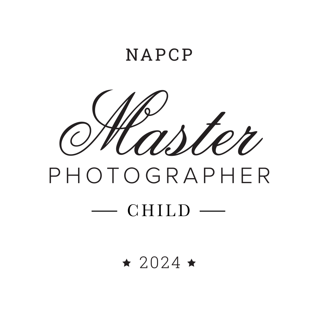A dark monochromatic emblem displaying 'NAFCP Master Photographer 2024' in elegant script and text.