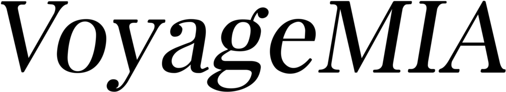 A simple black logo design with white text showing a proofreading or editing mark.