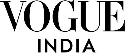 Black and white Vogue India magazine logo text on plain background.