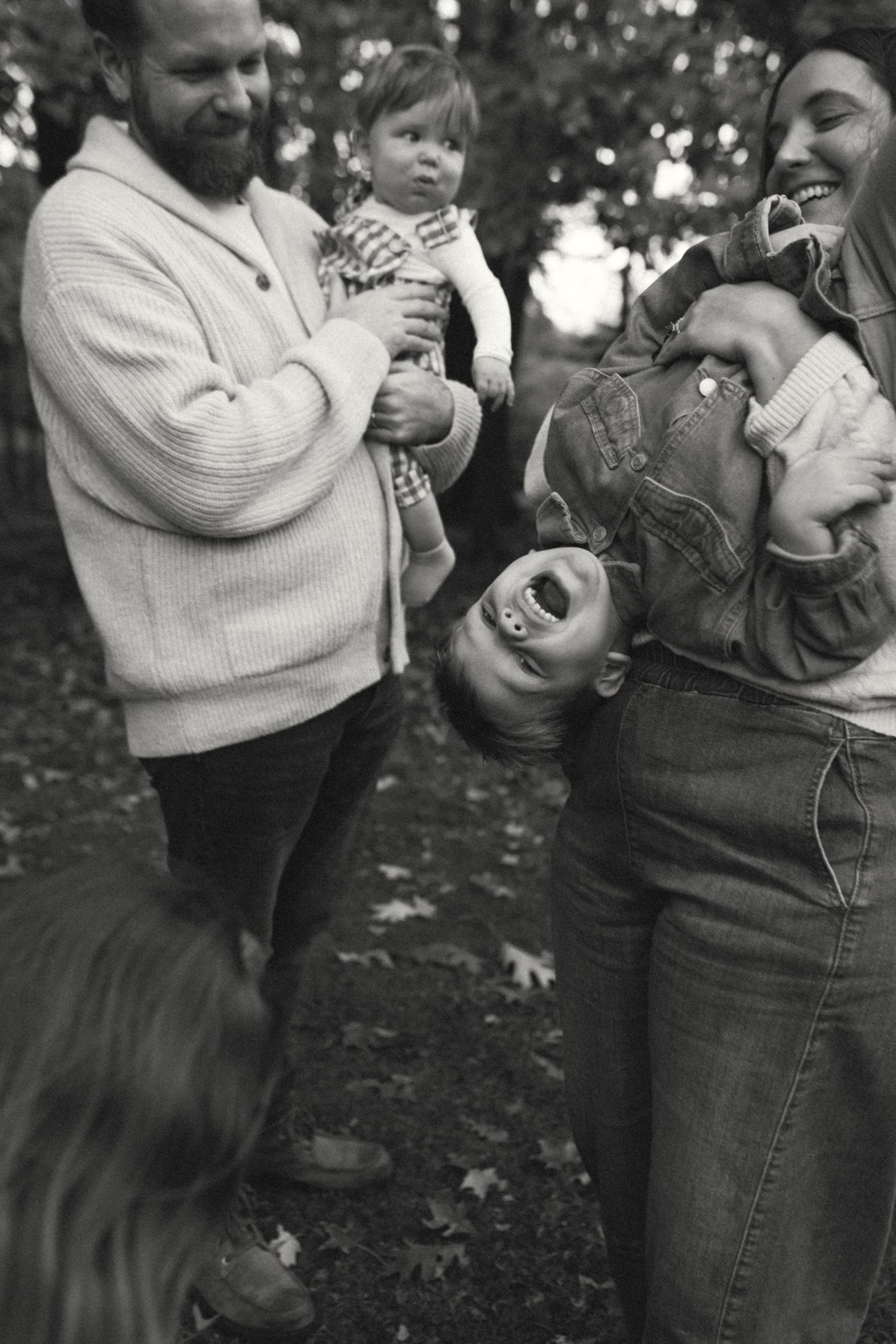 A black and white sequence shows a playful interaction between people in sweaters and jeans outdoors.