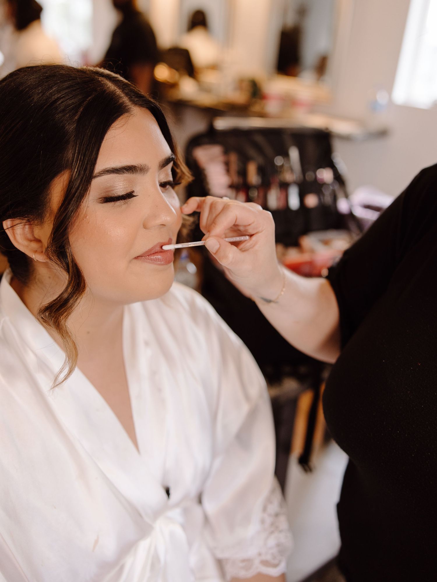 Bride's makeup application in progress, highlighting the importance of attention to detail I give to every client.