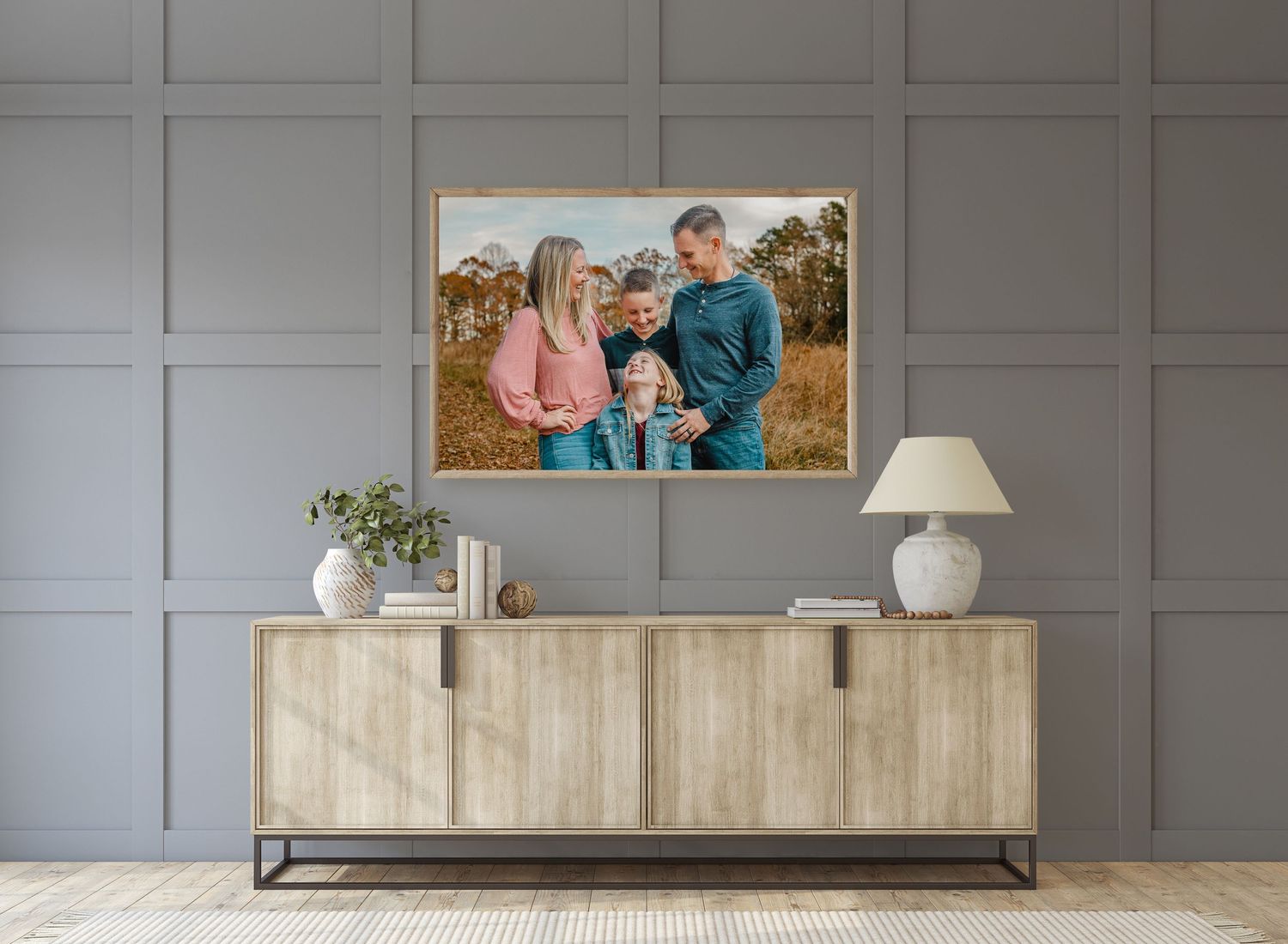 Heirloom-quality wall art featuring a family portrait designed by boutique photographer Brandy Lee, displayed in a modern living room.