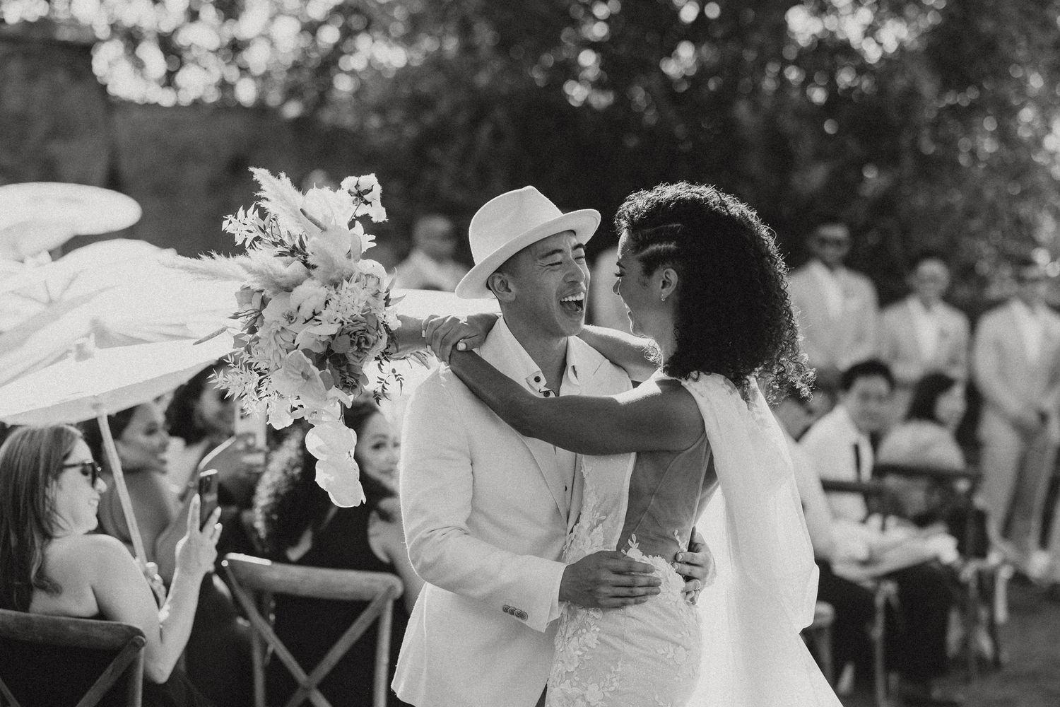 candid bride and groom celebrating after their wedding ceremony at Cielo Farms in Malibu captured by socal wedding photographer Jocelyn Ann