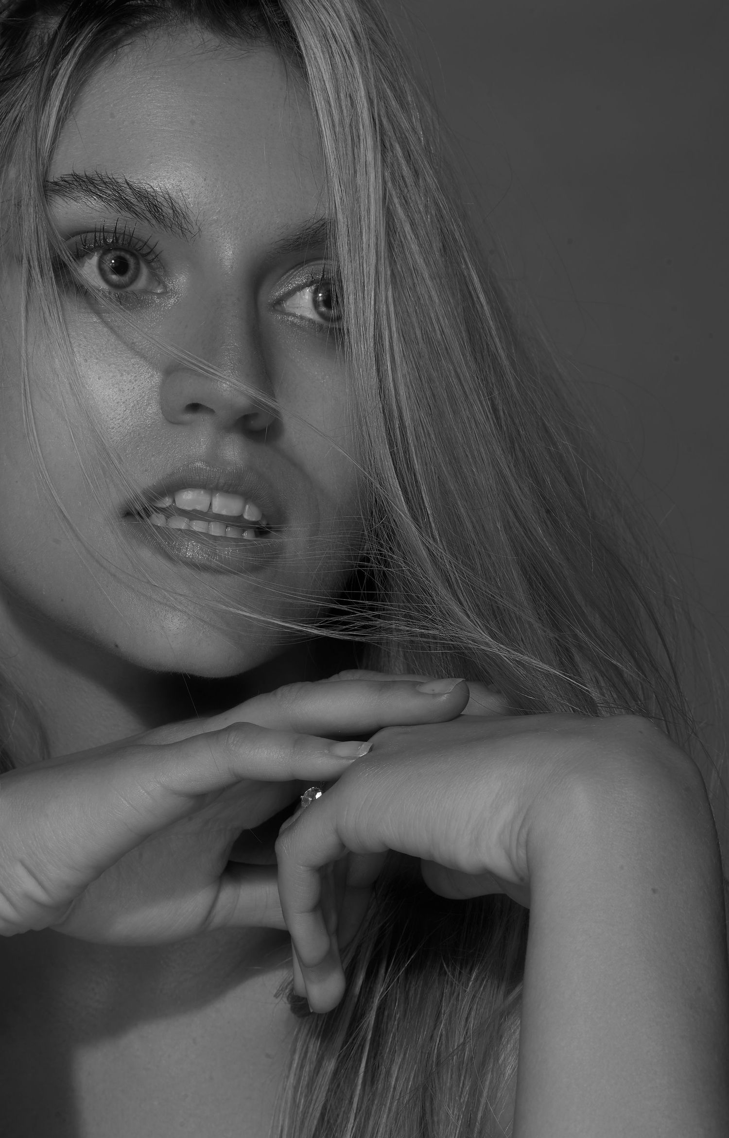 Dramatic black and white beauty portrait with striking eye contact.