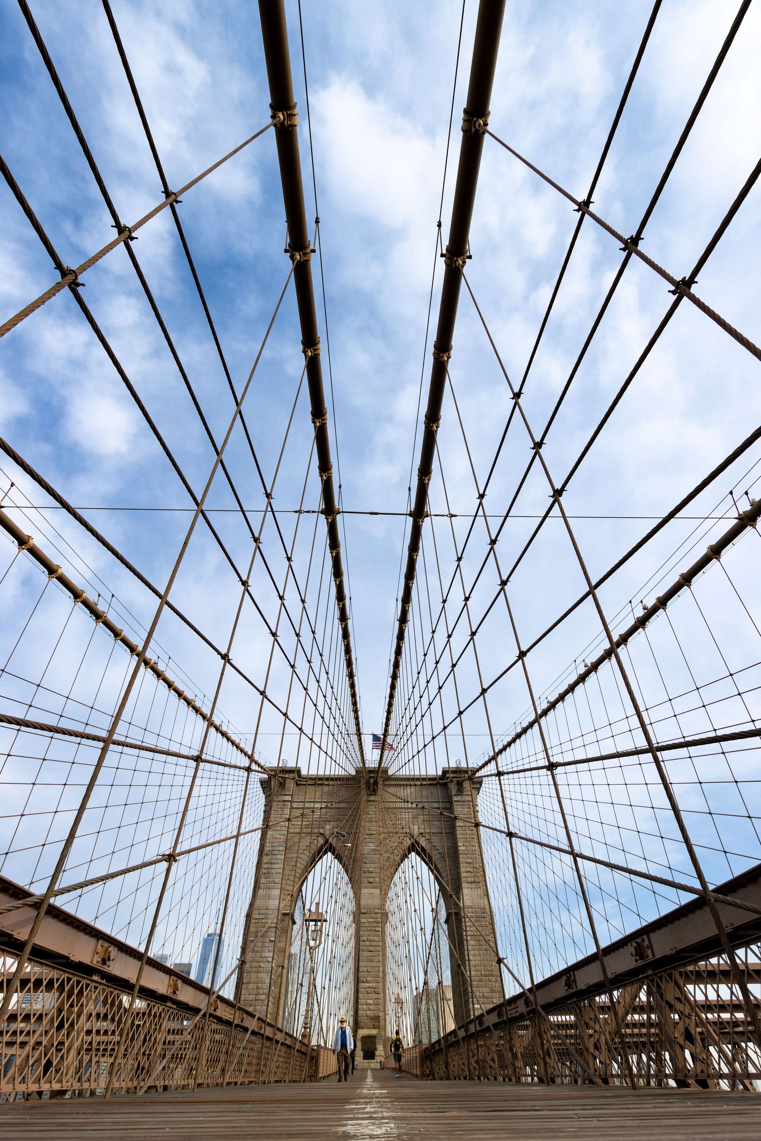 An early morning walk on Brooklyn Bridge looking towards Manhattan and One World Trade Center New York by Kush Rattan Ph