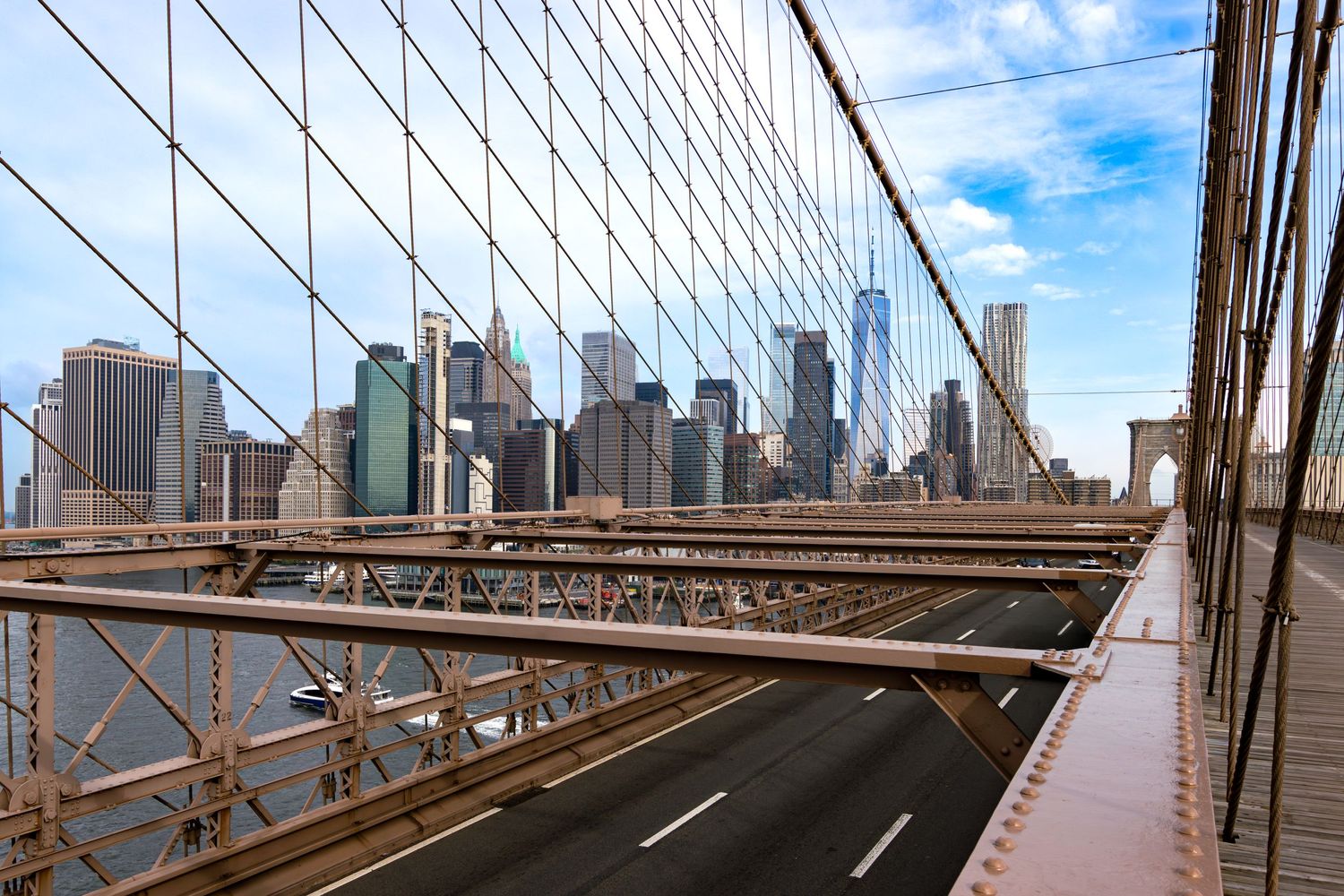 The Brooklyn Bridge connecting the Financial District of Manhattan New York to Brooklyn over the East River by Kush Ratt