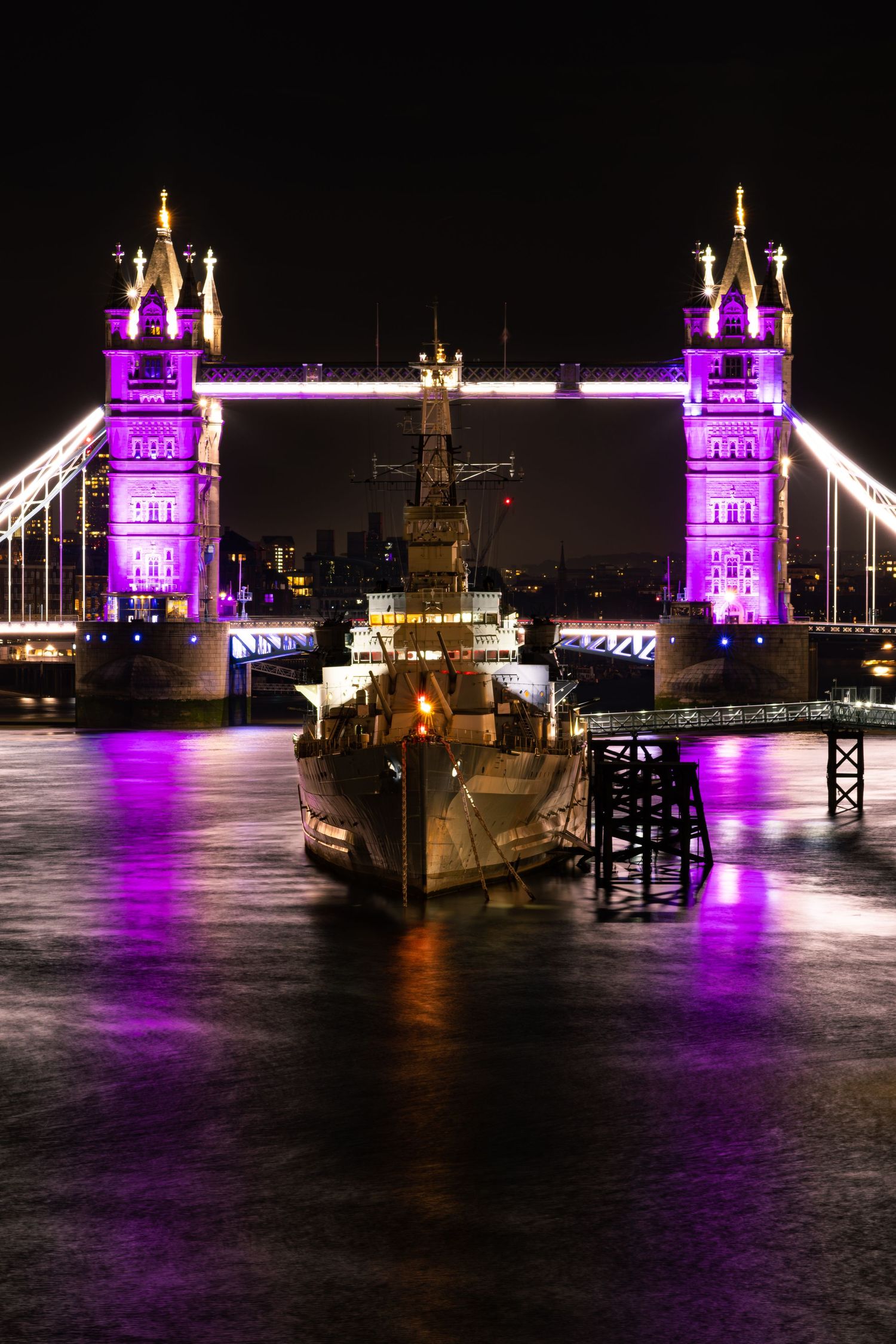 HMS Belfast and Tower Bridge lit up for Her Majesty Queen Elizabeth II Platinum Jubilee 2022 by Kush Rattan Photography