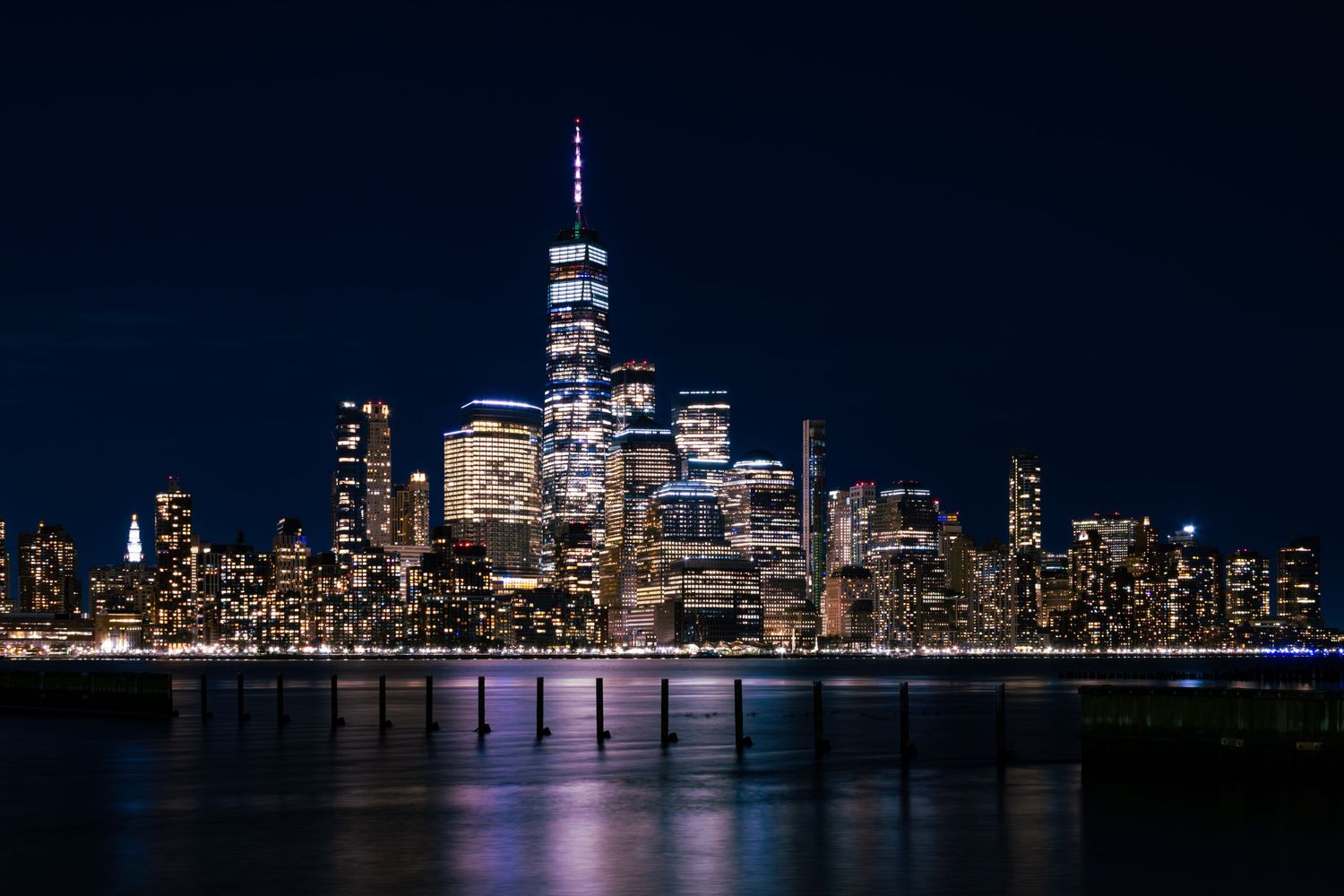 Manhattan skyline with One World Trade Centre at night taken from across the Hudson River at Newport, Jersey City, New J