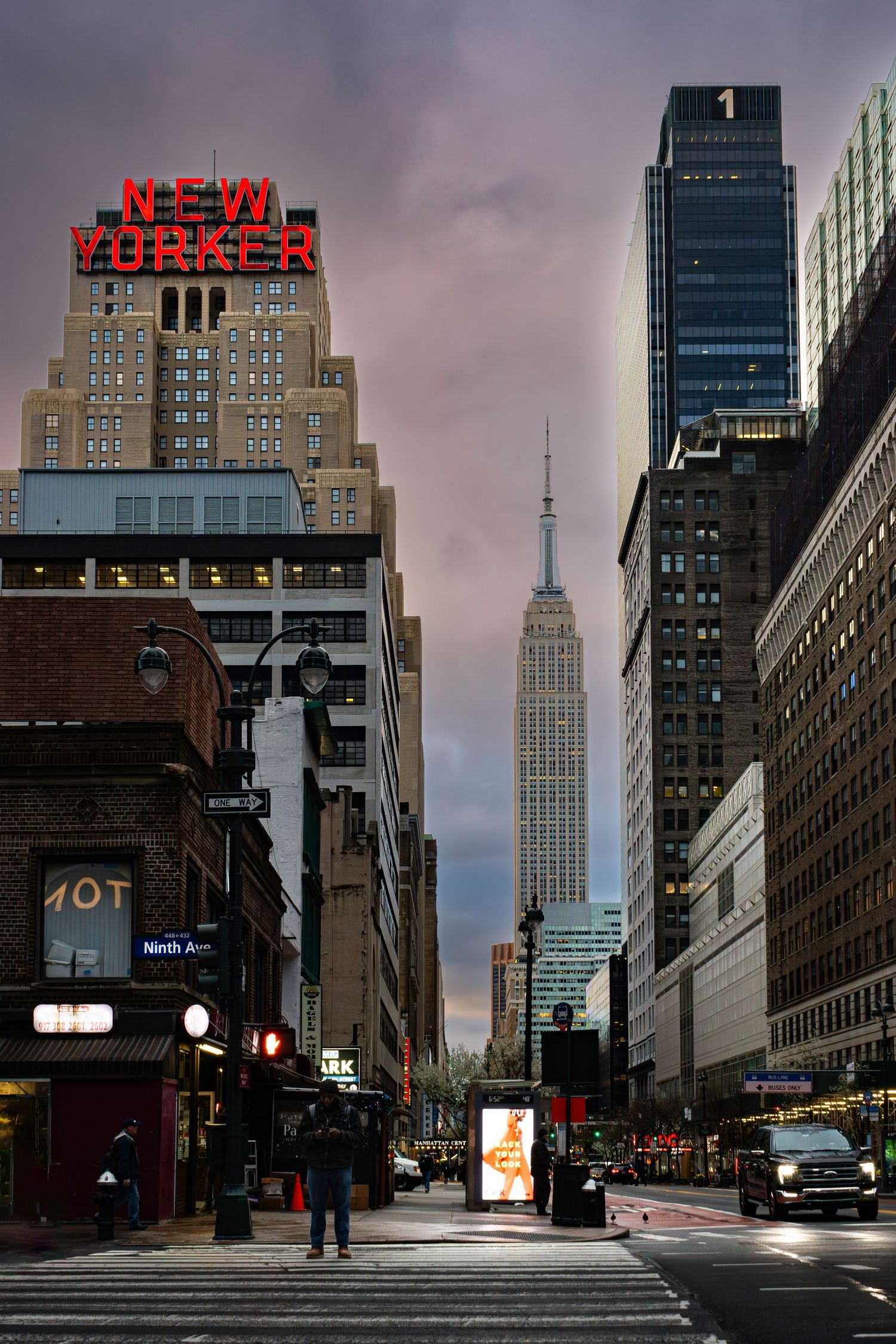 Sunset in Manhattan New York looking towards The Empire State Building and the New Yorker Hotel as seen from Ninth Avenu