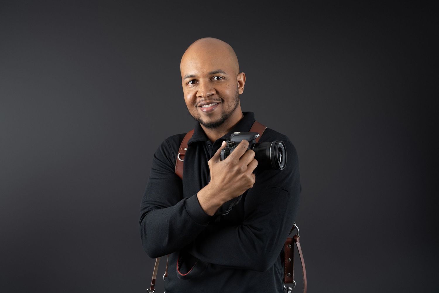 Professional studio portraits showing different expressions and poses against a dark background.
