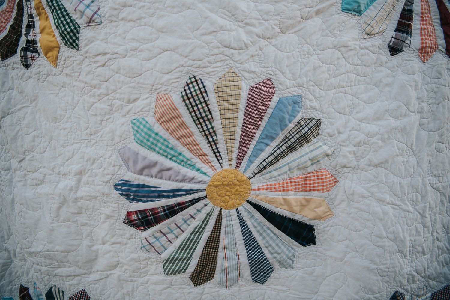 Dresden flower made from quilted dress shirts.