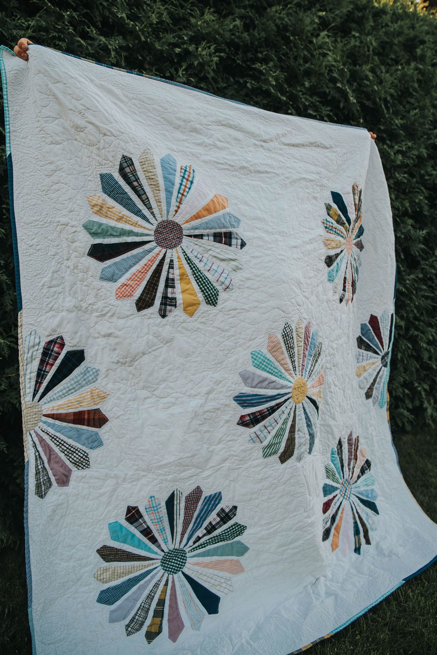 Memorial quilt made with a father's dress shirts and a Dresden flower pattern.