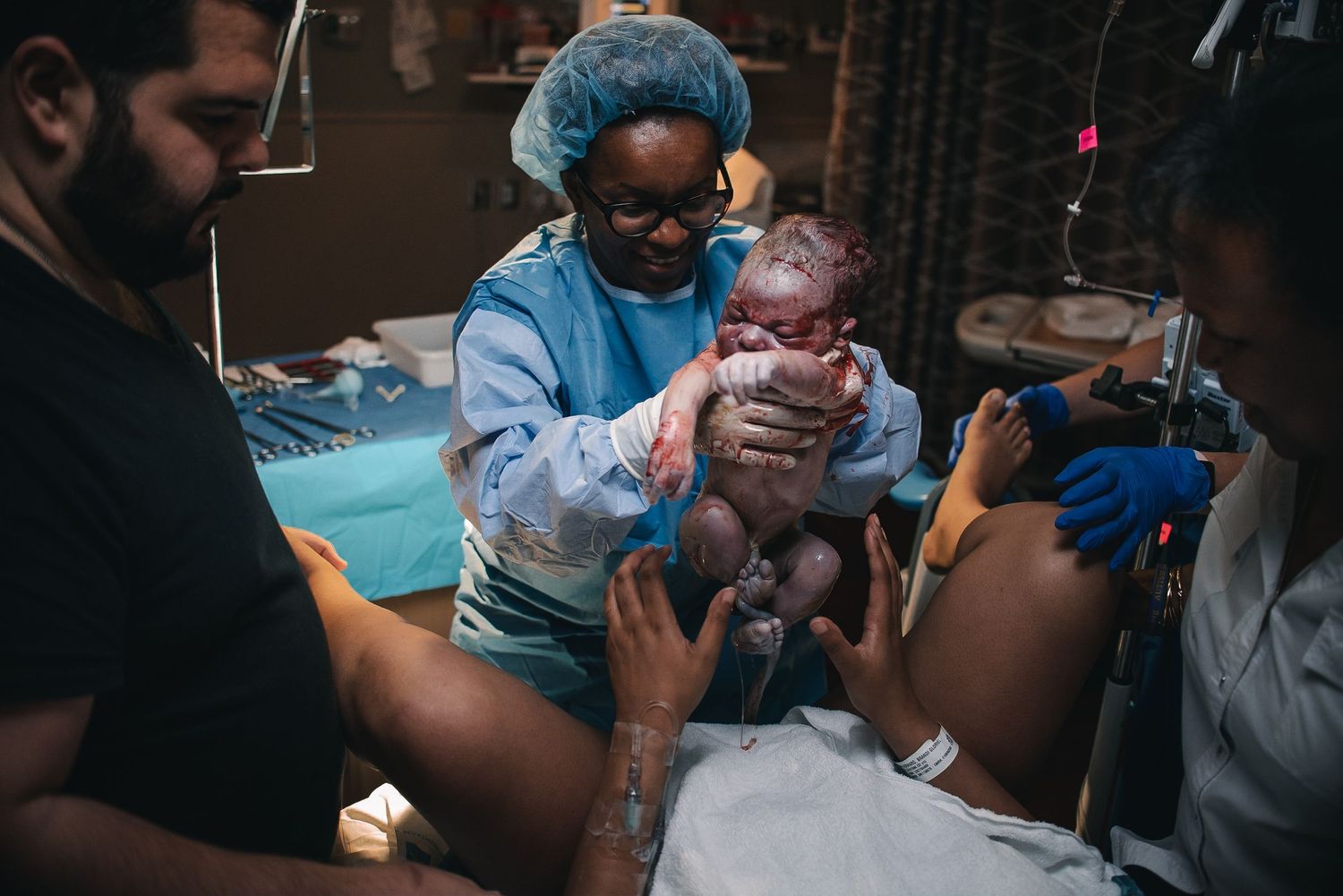 Doctor Hands Mother Her Freshly Born Baby at Sibley Hospital