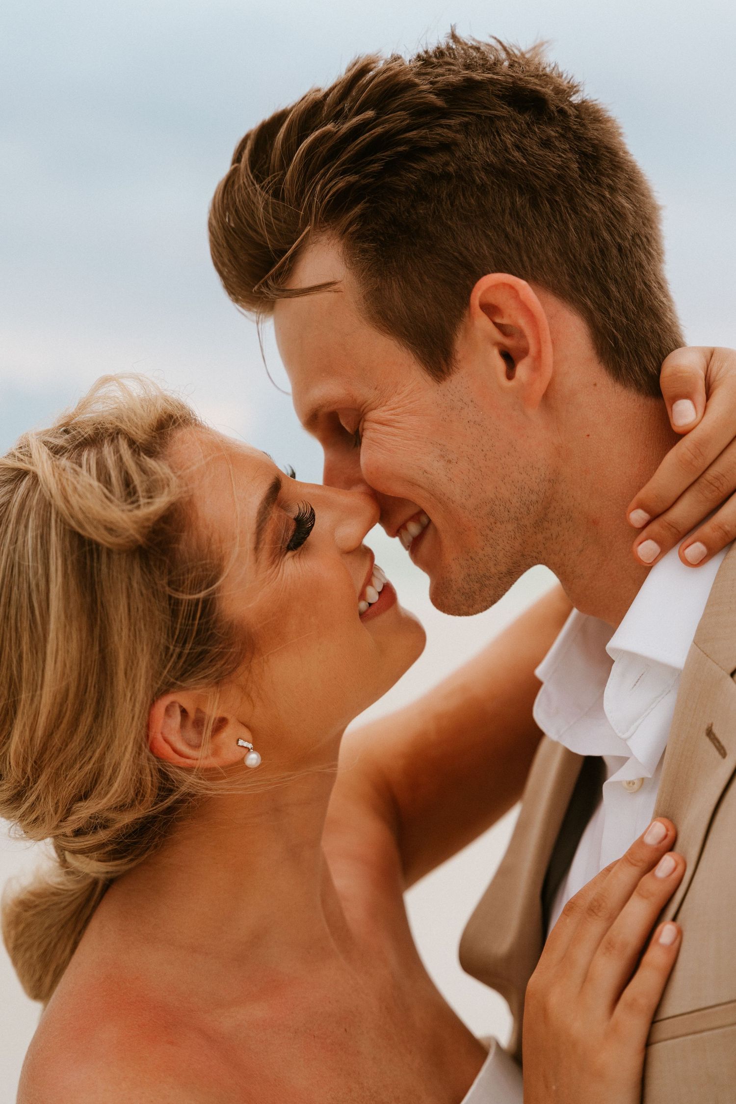 a wedding couple laughing together in Santa Rosa Beach
