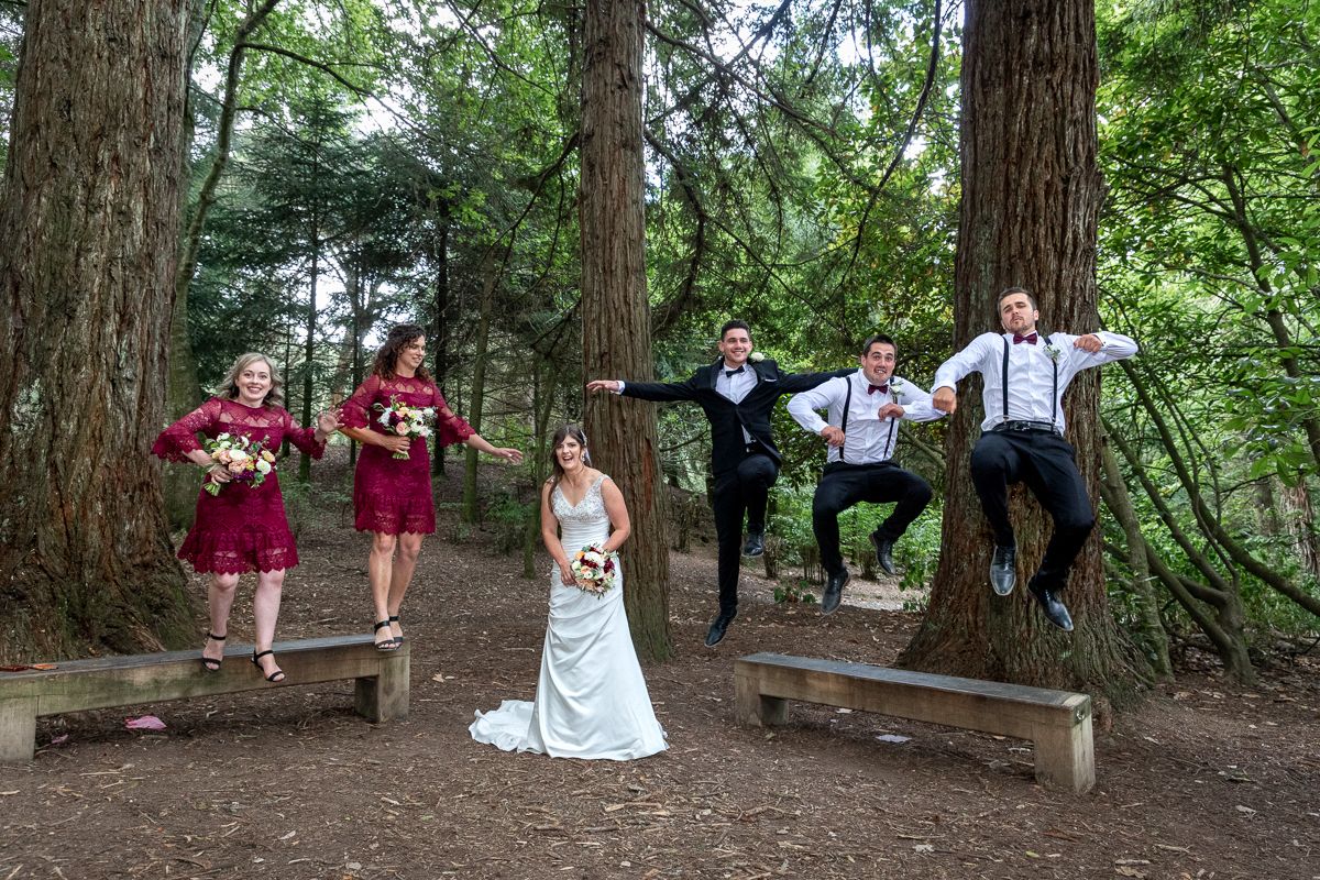 Full Bridal Party jumping for joy
