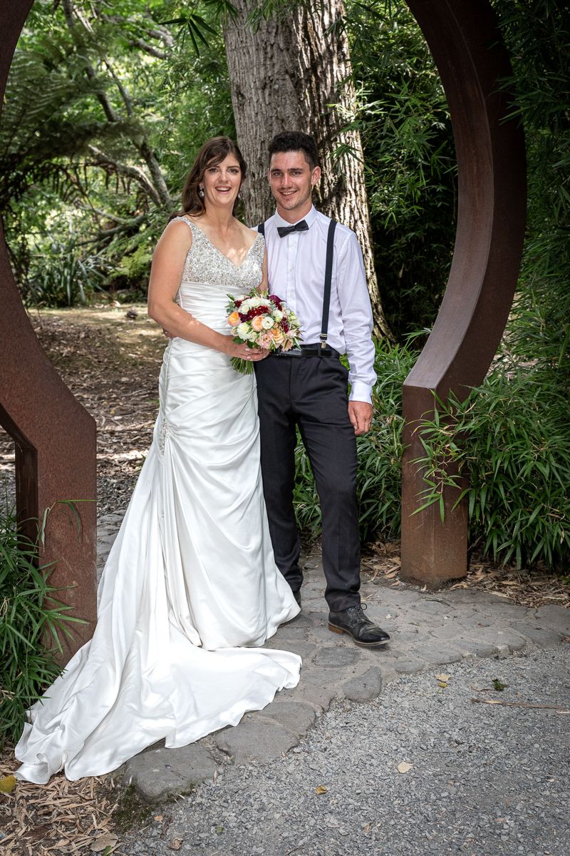 Groom and Bride smiling in garden