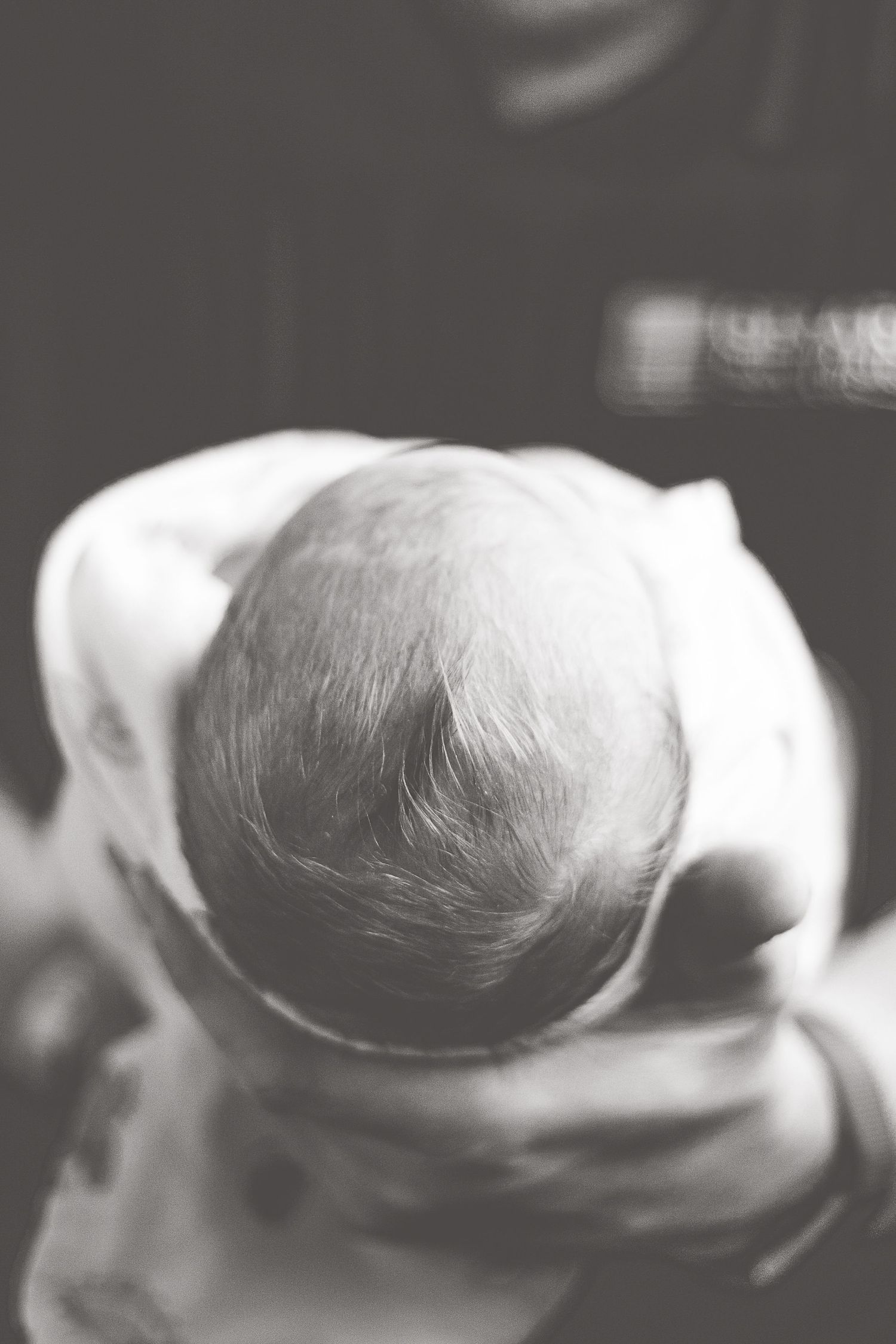 black and white photo of newborn baby's hair