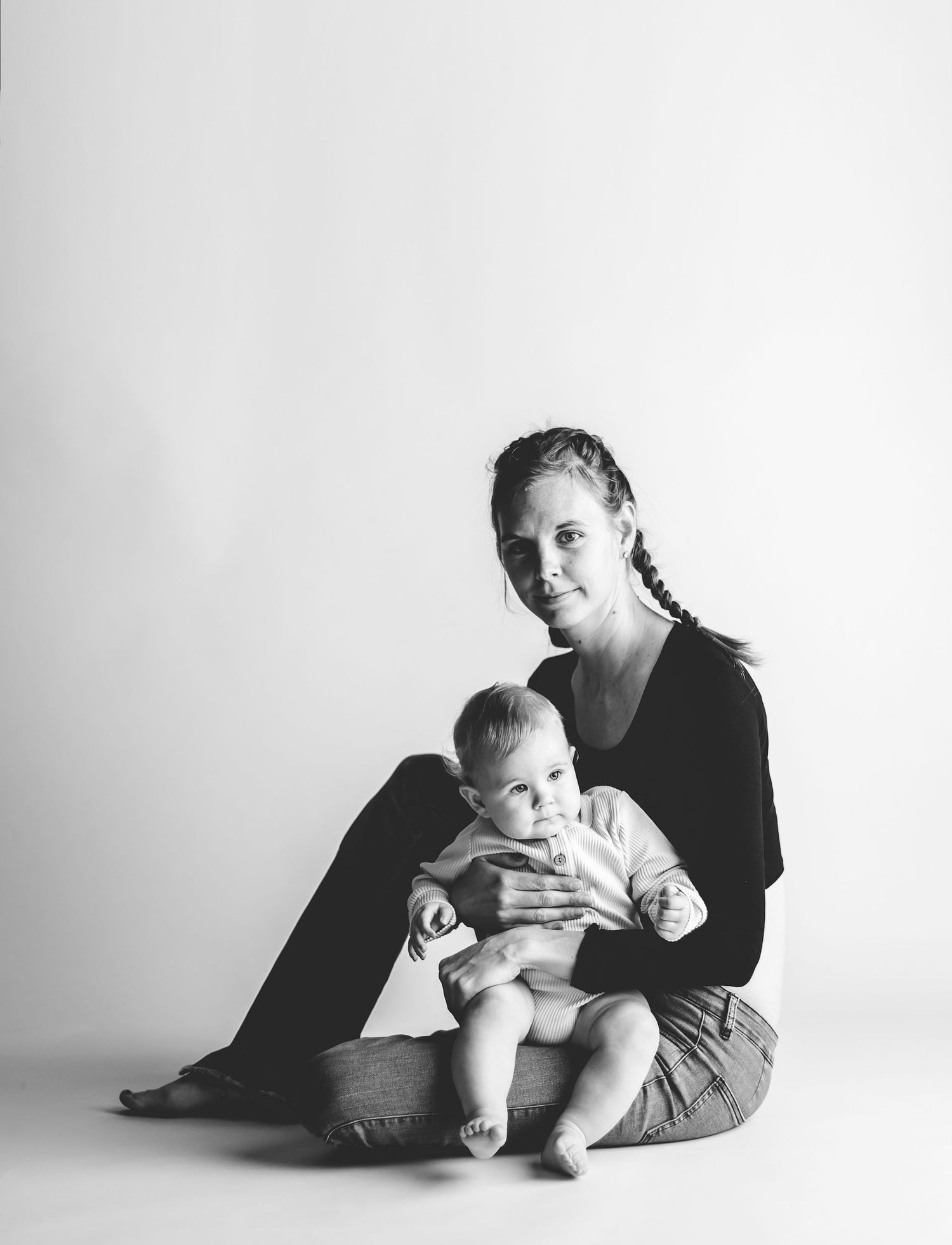 mother and her son posing for a studio photoshoot