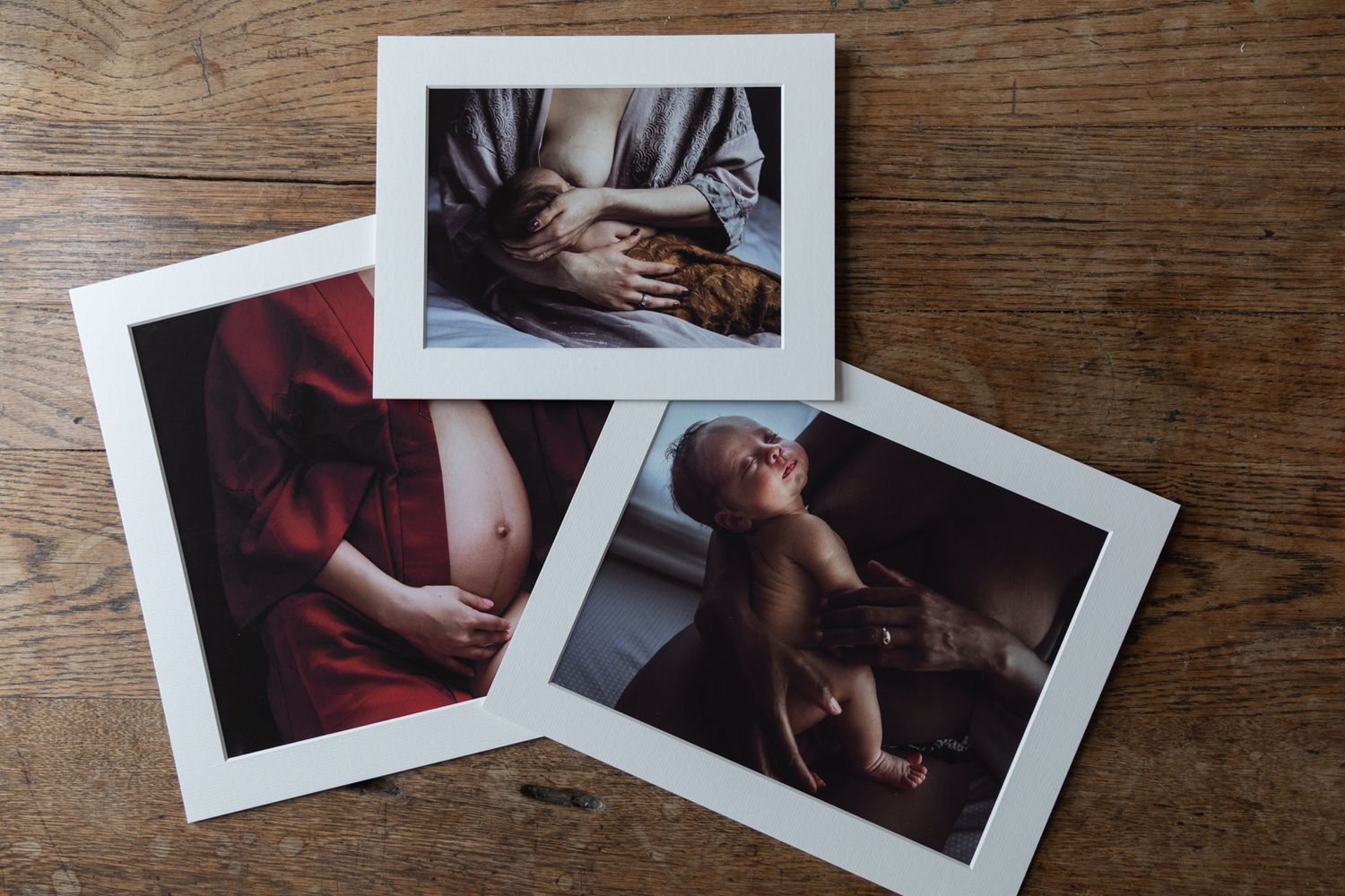 fine art maternity photography photos matted prints of images lays on table