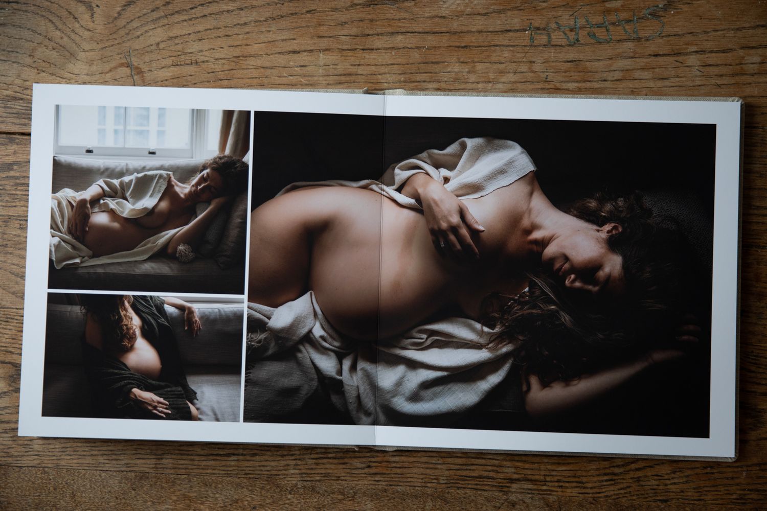 fine art maternity photography photo book album of images lays on table