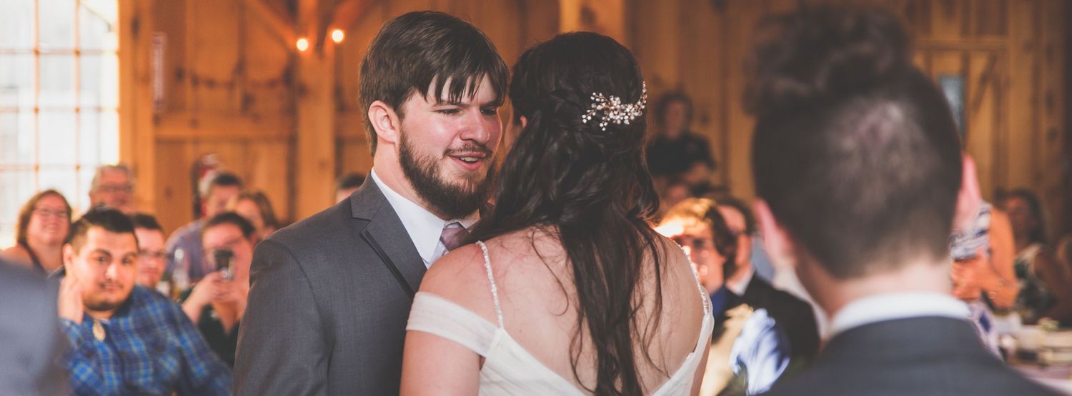 A newlywed couple having their first dance.