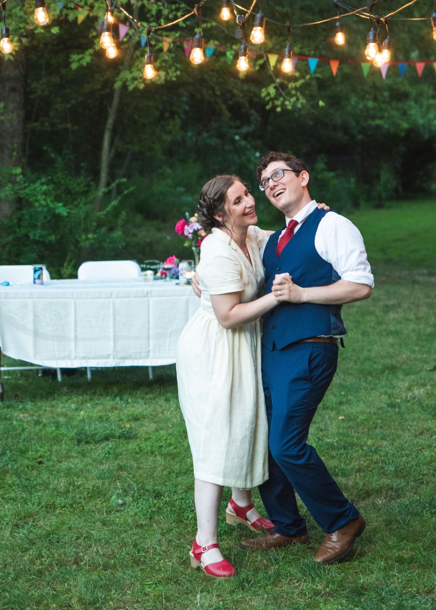 A newlywed couple having their first dance.