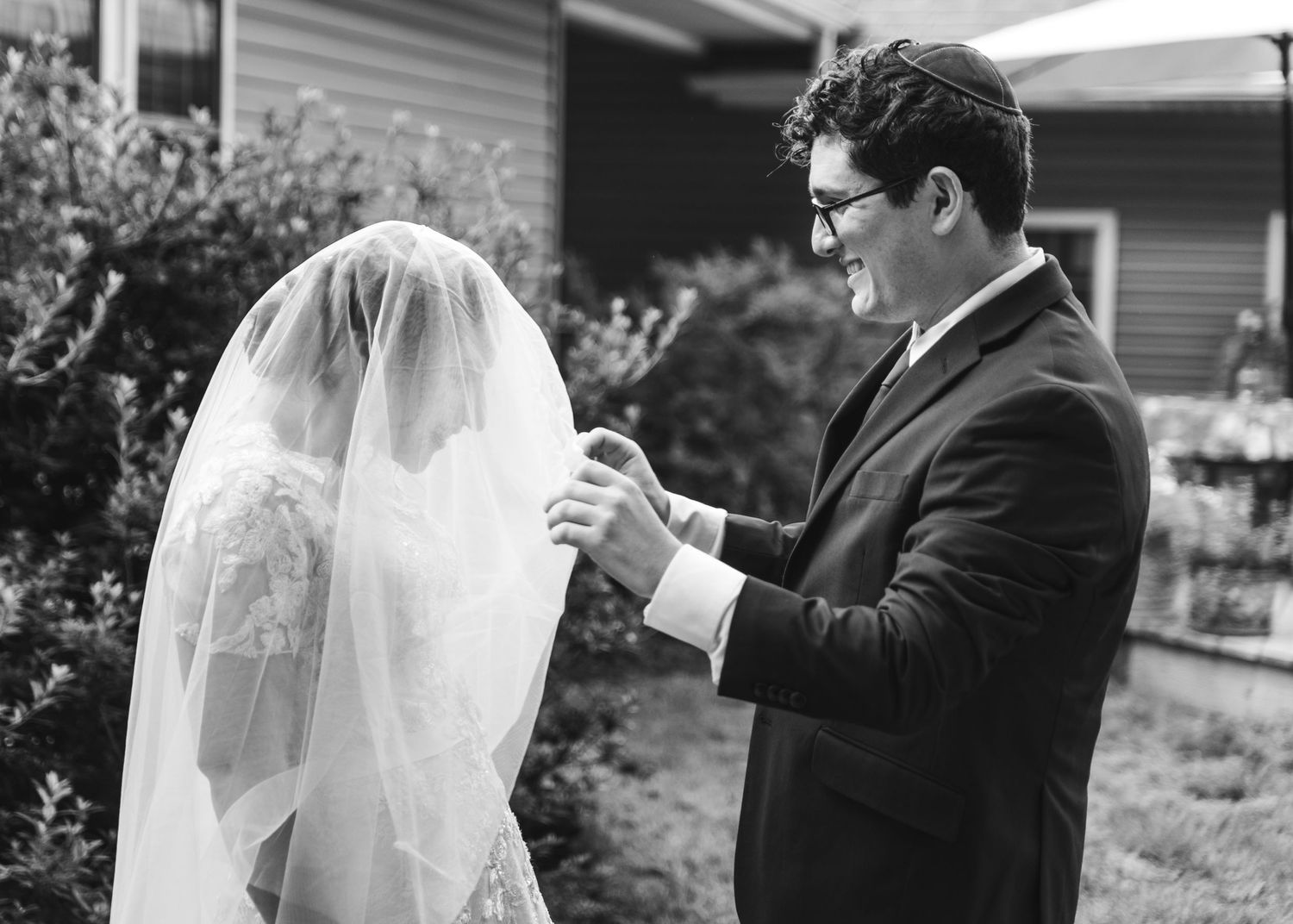 A first look between a bride and groom before their wedding.