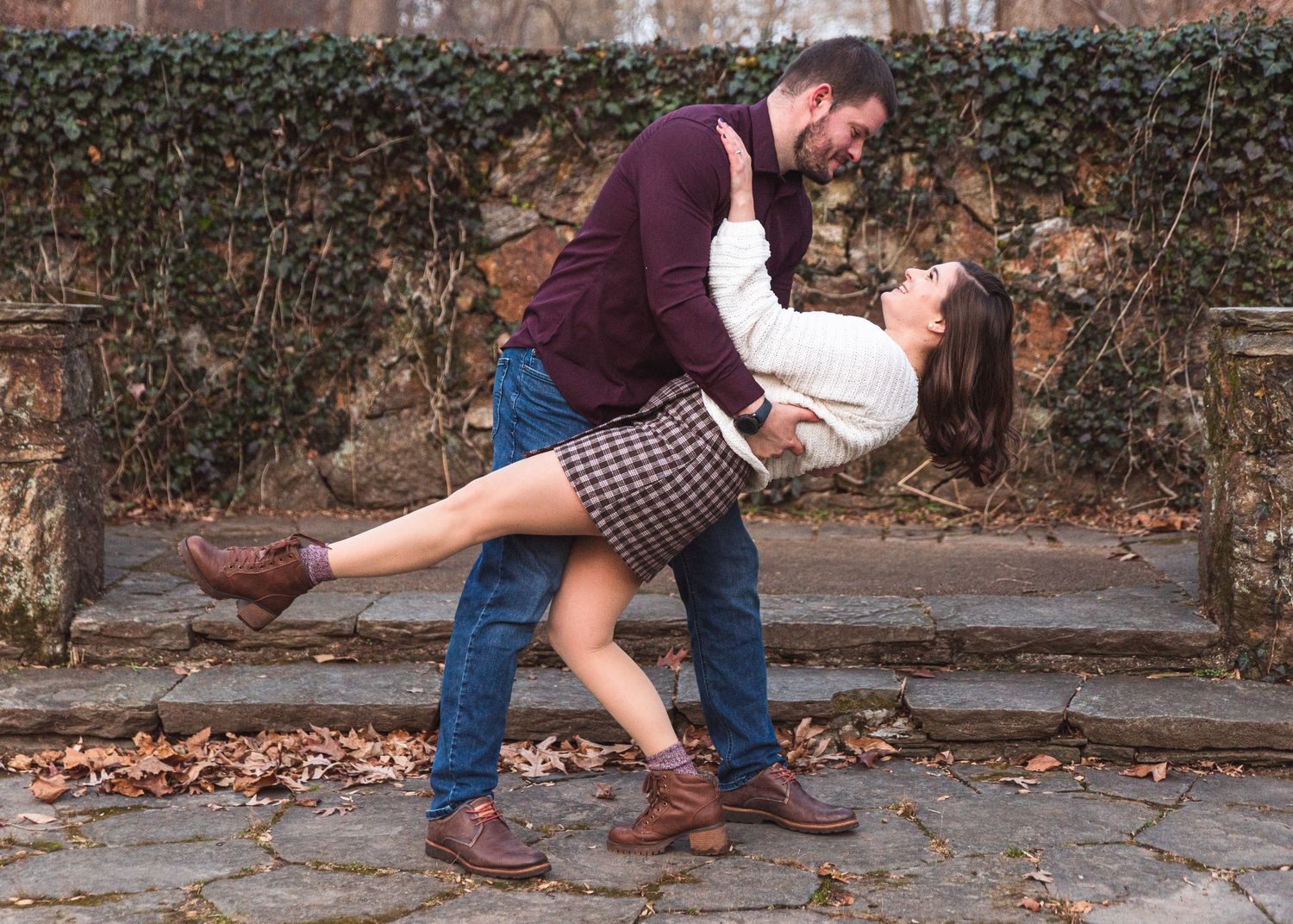A newly engaged couple, he is dipping her.
