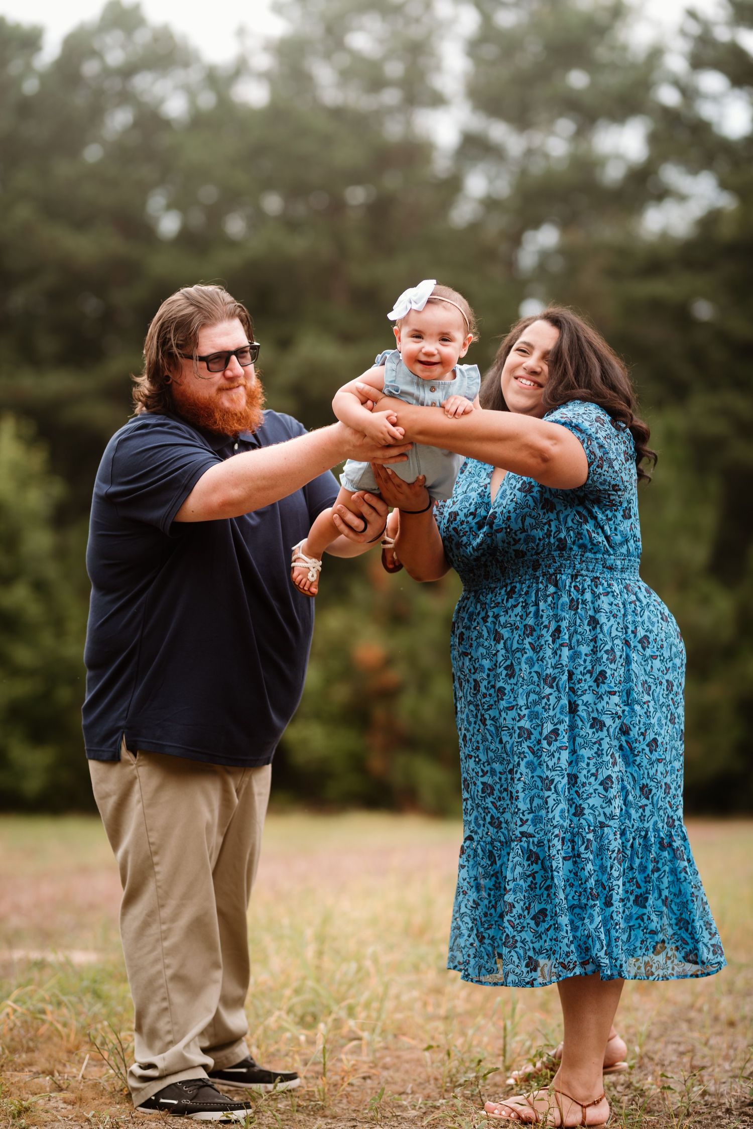 A playful family photo sequence showing interaction on a grassy field.