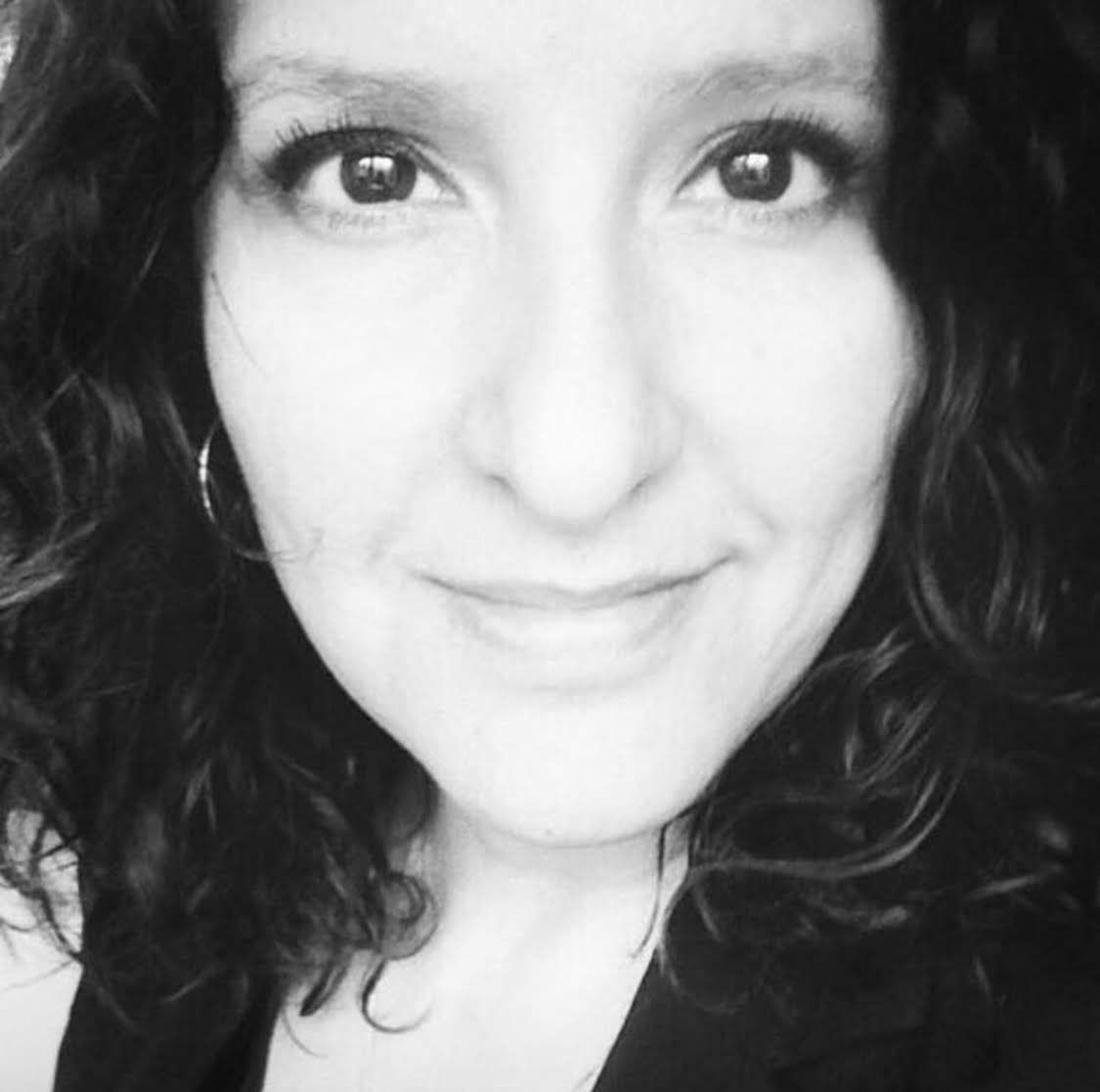 High contrast black and white portrait with expressive eyes.