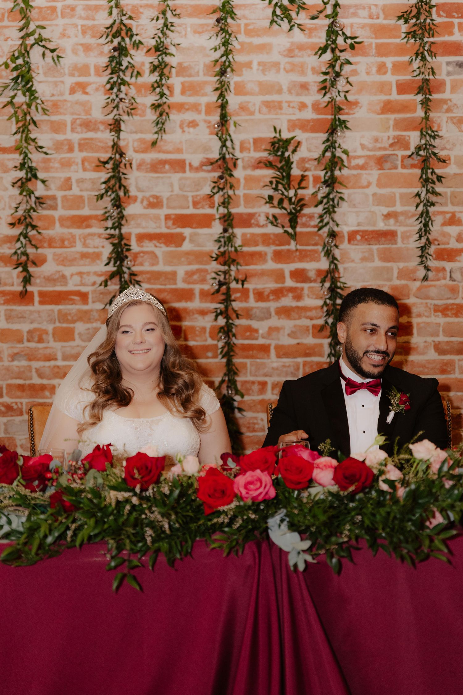 Elegant wedding reception at The 1206 in Crete, Nebraska, with glowing lights and joyful guests celebrating the newlyweds