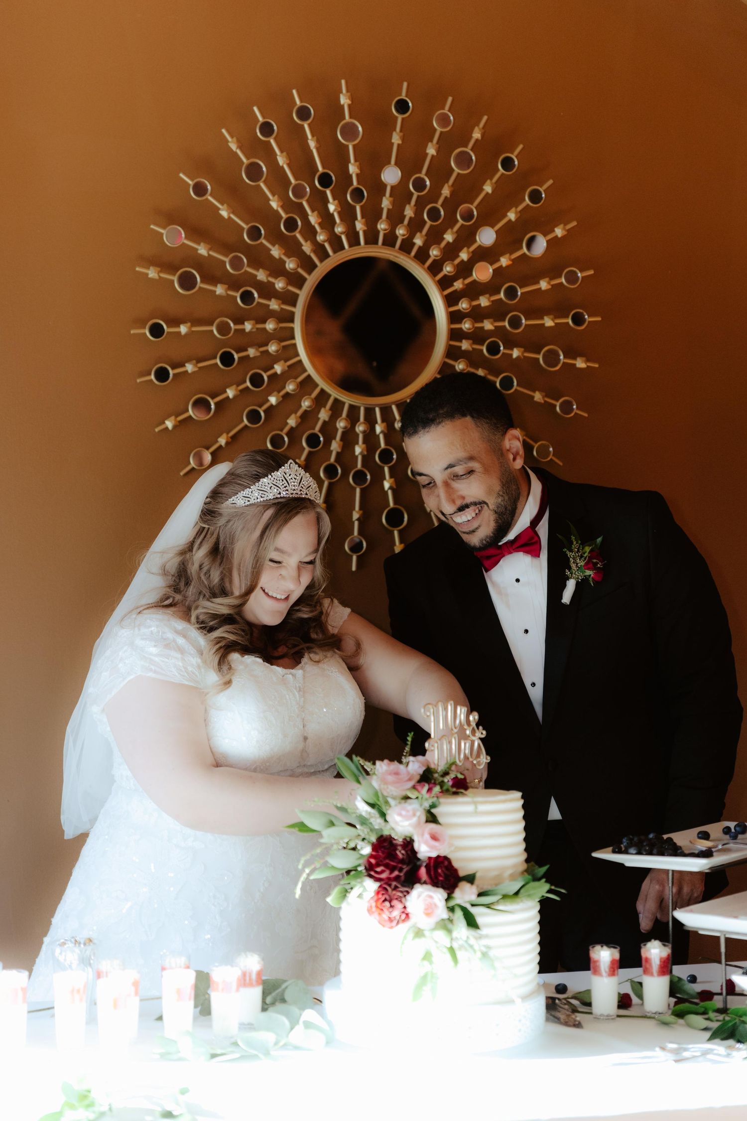 Elegant wedding reception at The 1206 in Crete, Nebraska, with glowing lights and joyful guests celebrating the newlyweds